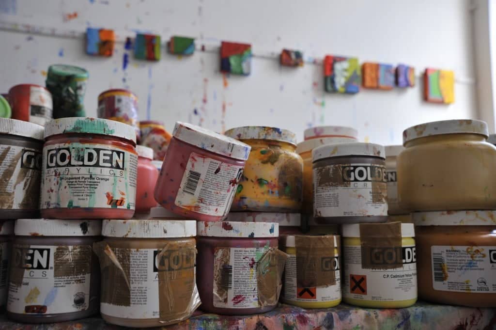 Paint pots in artist Anthony Frost's studio. Photo © Brian Benson, 2016. Image courtesy DACS.