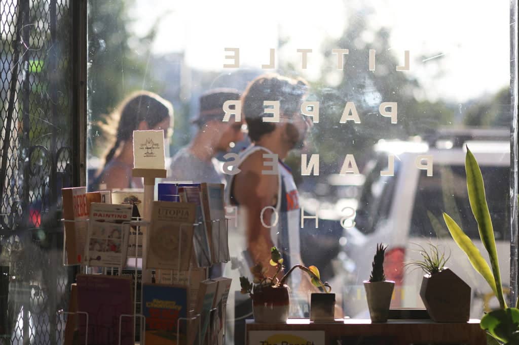 people passing in front of studio window