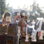 people passing in front of studio window