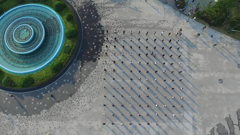 Isaac Chong Wai , One Sound of the Futures, 2016. Preview Version. 3 Channel Video, HD loop: 7:13 min. Photo Edition, Acrylic glass on photo prints. Performance at Kai Tak Runway Park in Hong Kong, Democracy Square in Gwangju in South Korea, K11 Artist Village in Wuhan in China at the 5th Large-Scale Public Media Arts