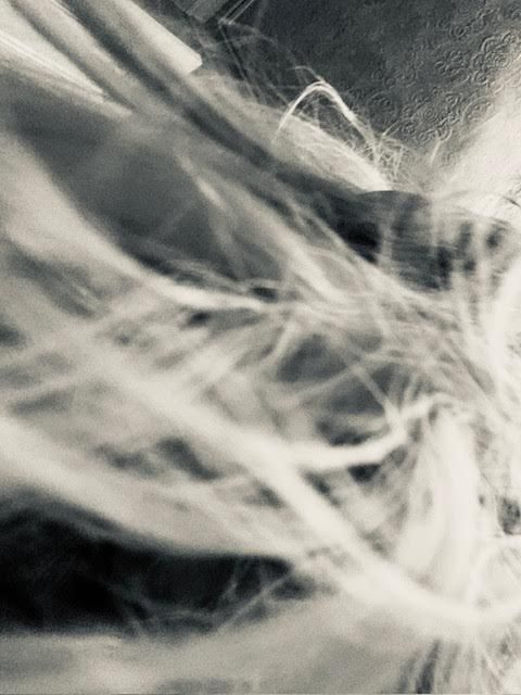 [black and white high tone photo of hair strands and Anaglypta wallpaper}