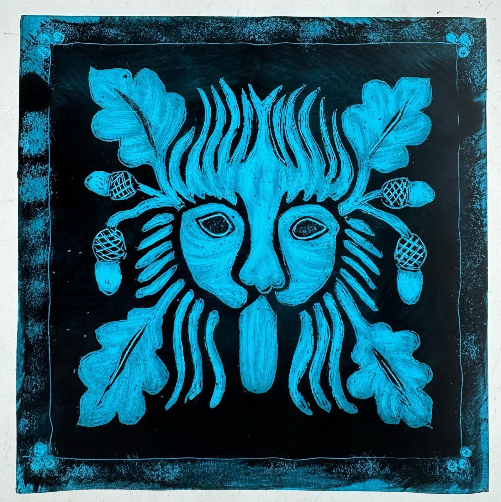 Painted green man face with acorns on glass