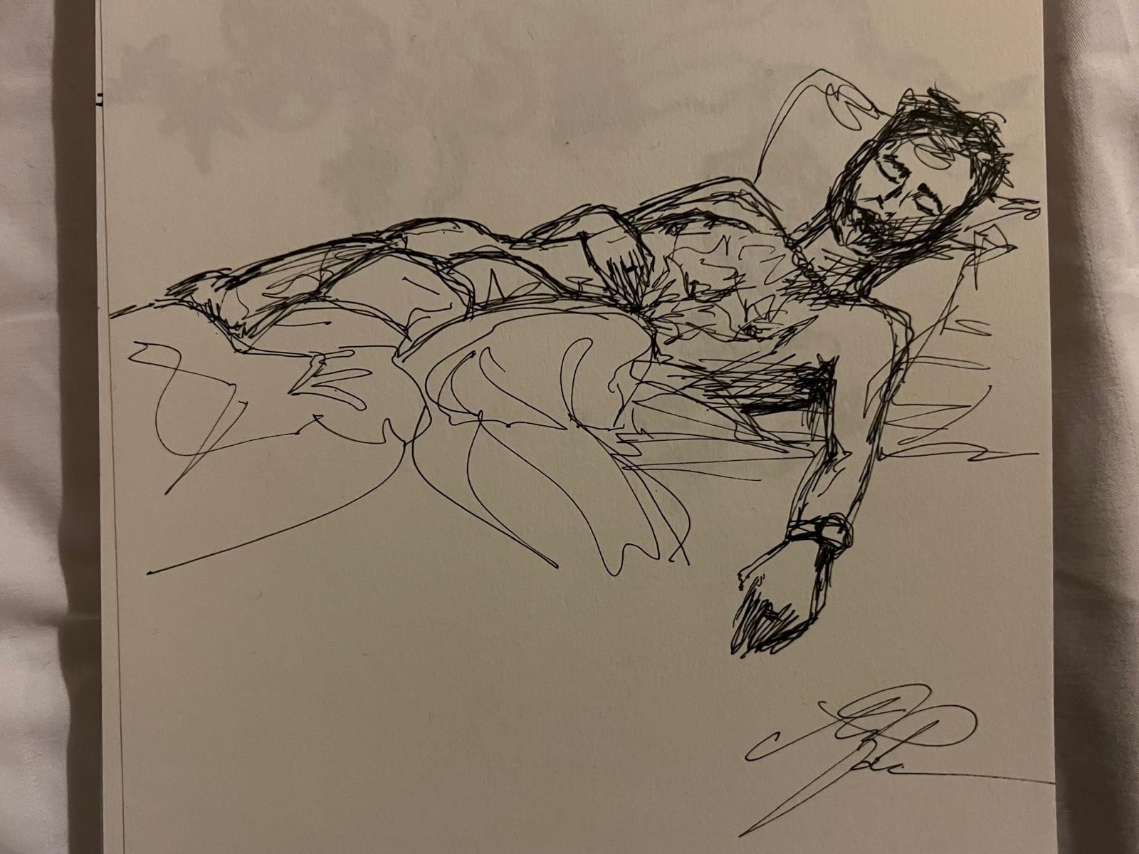 Pen and ink drawing of a man laying down with his eyes closed.