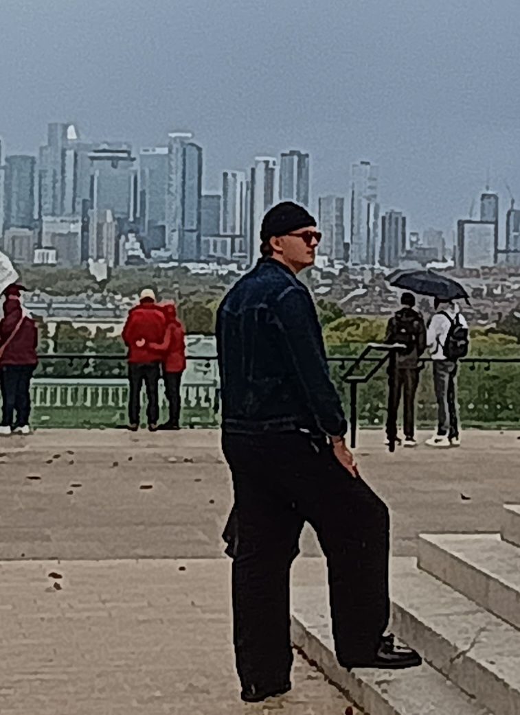 Man standing on a viewing area in Greenwich