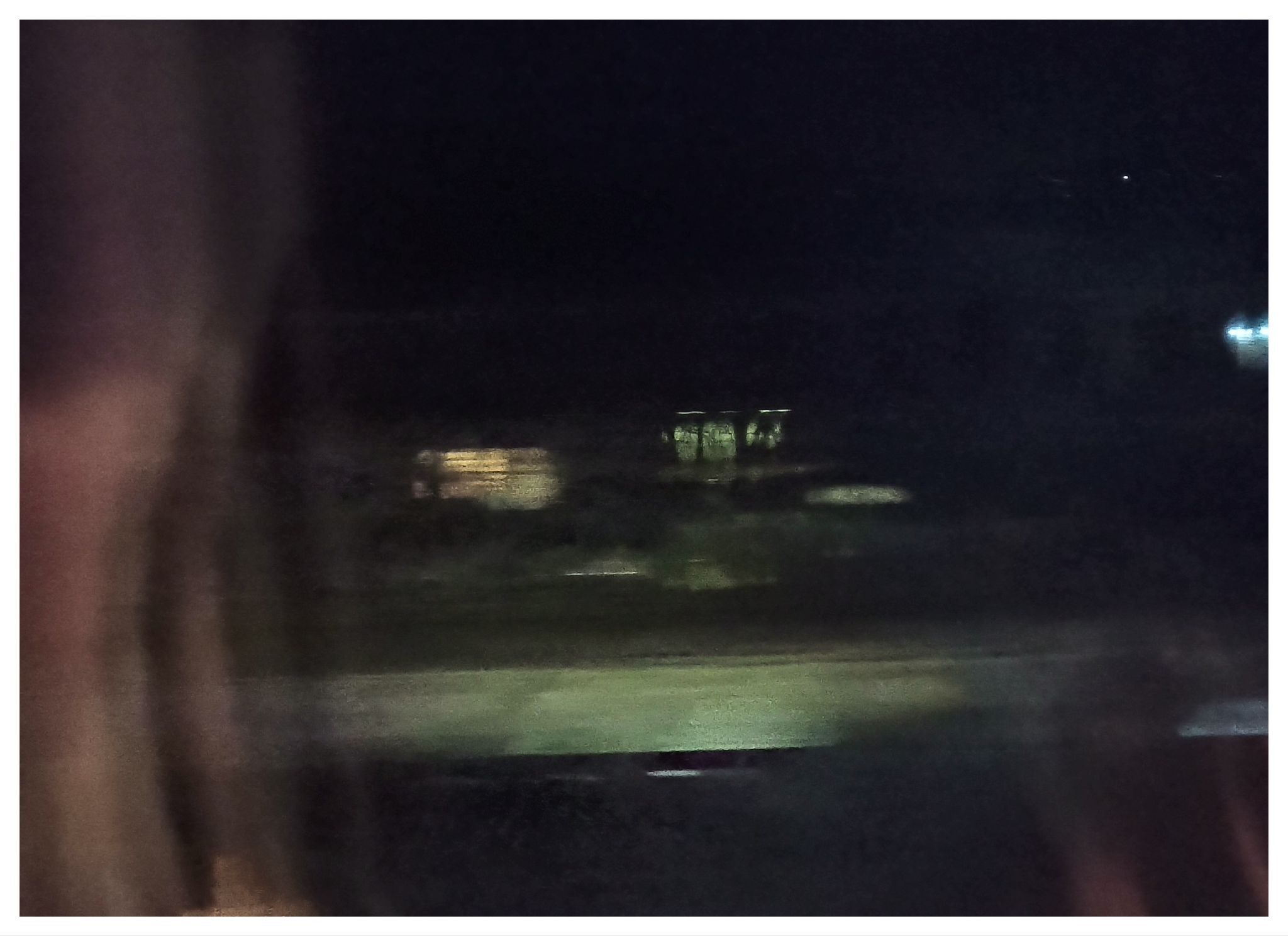 Photograph of a suburb of Bournemouth seen from a train window at night