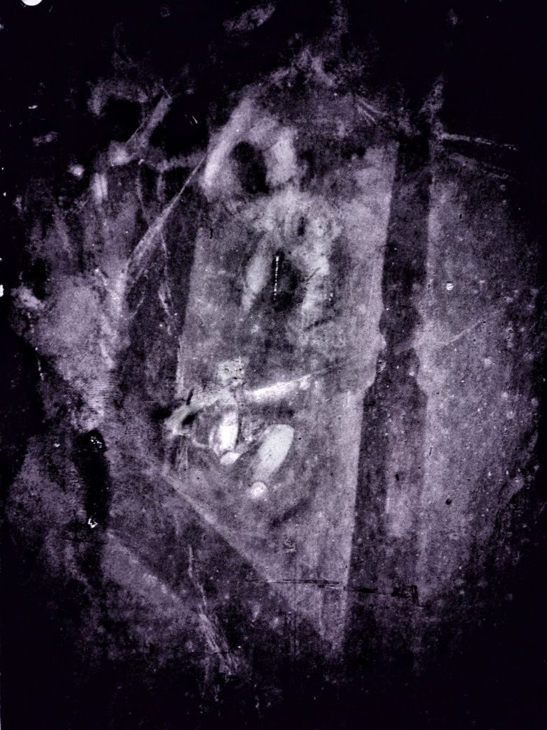 in the dark at the top of the stairs