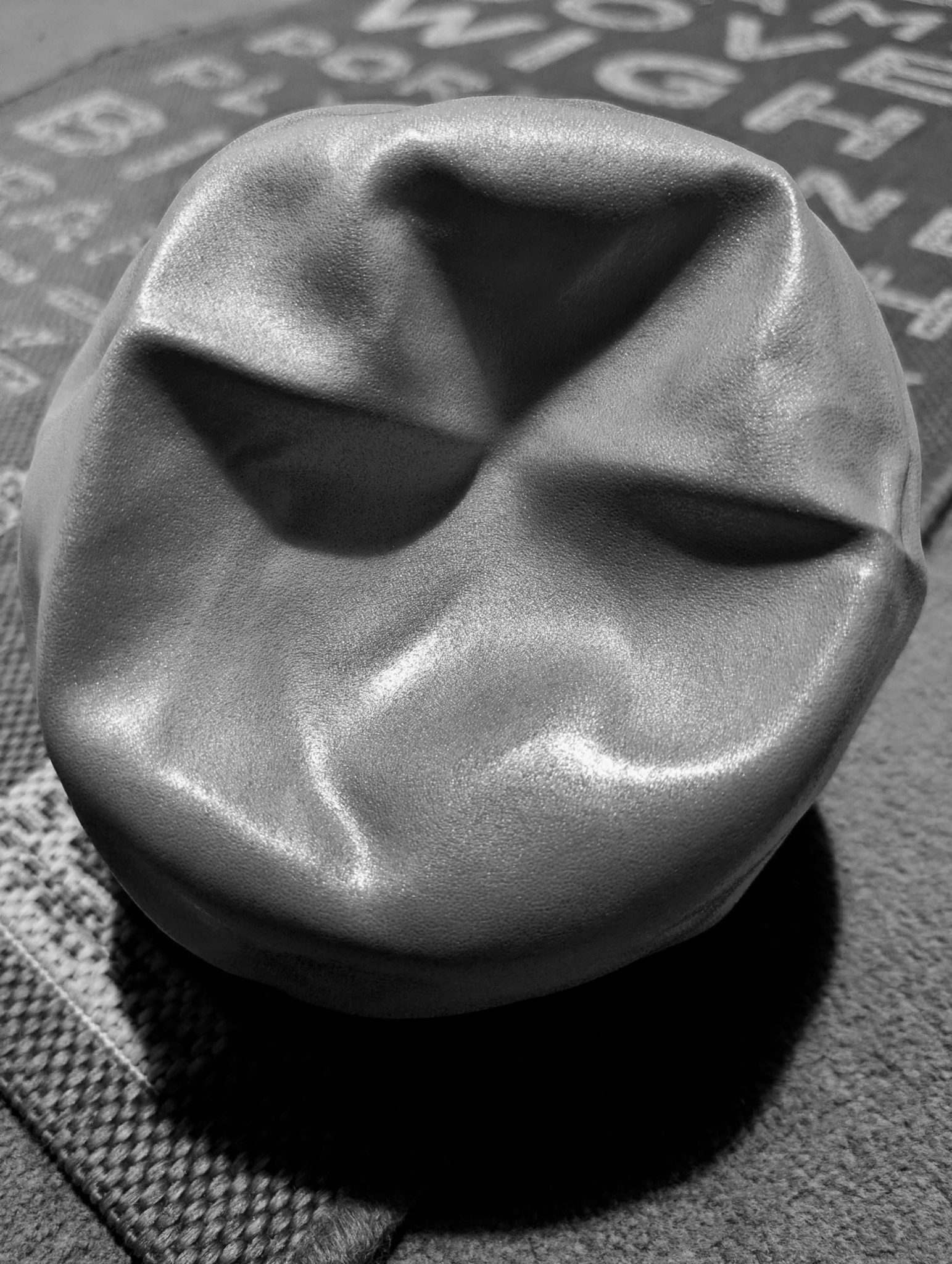 Deflated exercise ball in black and white