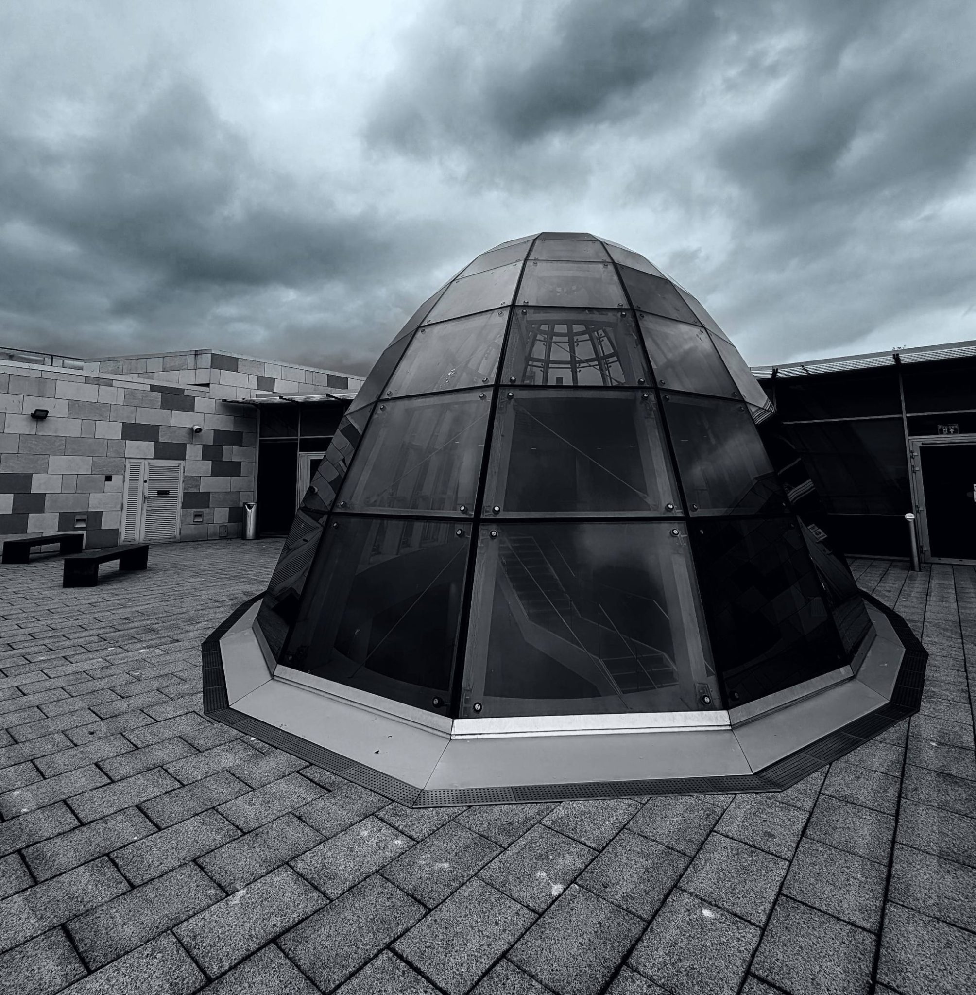 Black and white landscape of a glass dome on a building