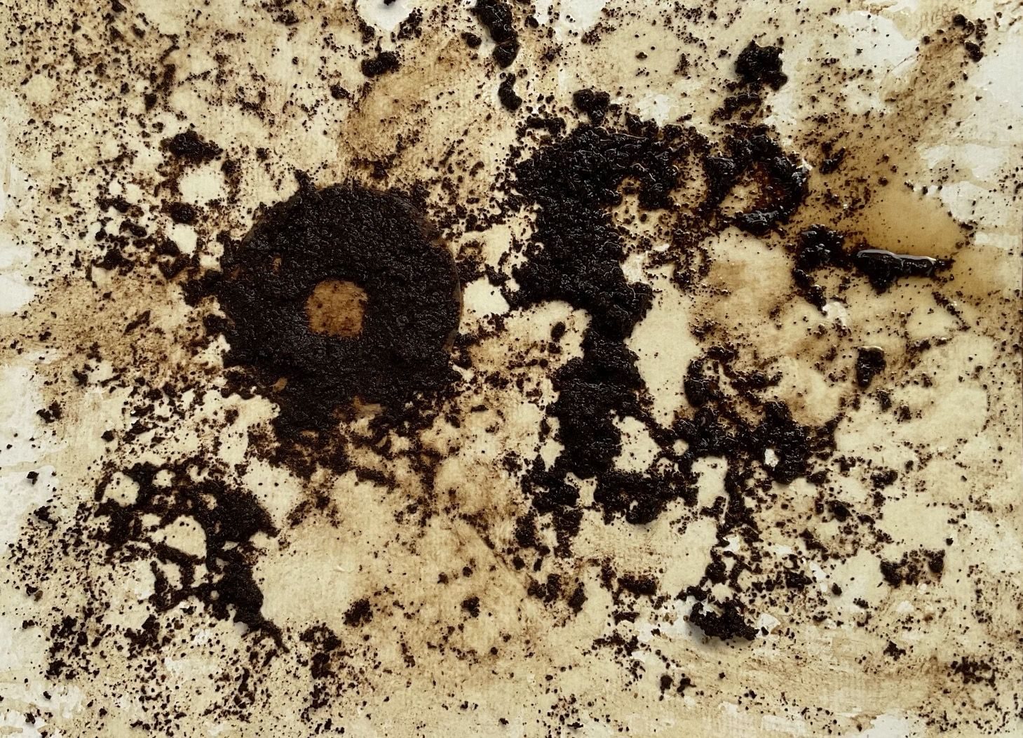 Coffee filter and grains smeared on paper