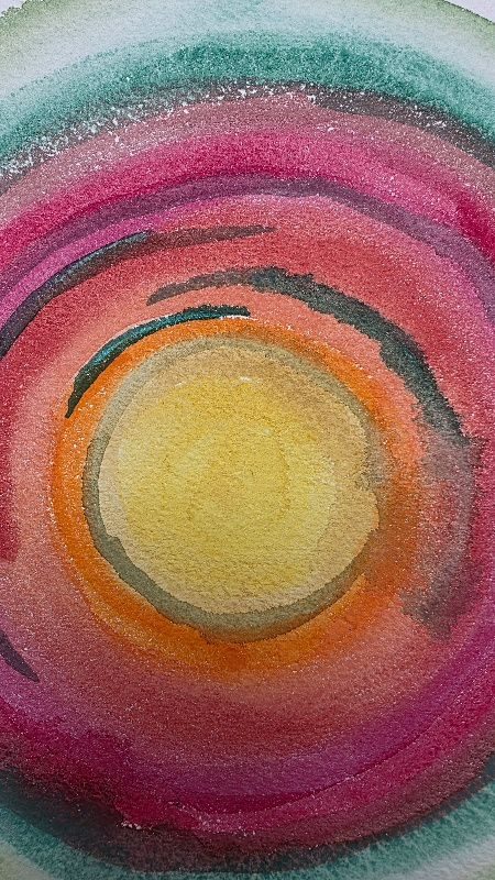 Abstract circles in reds, greens and yellows in watercolour