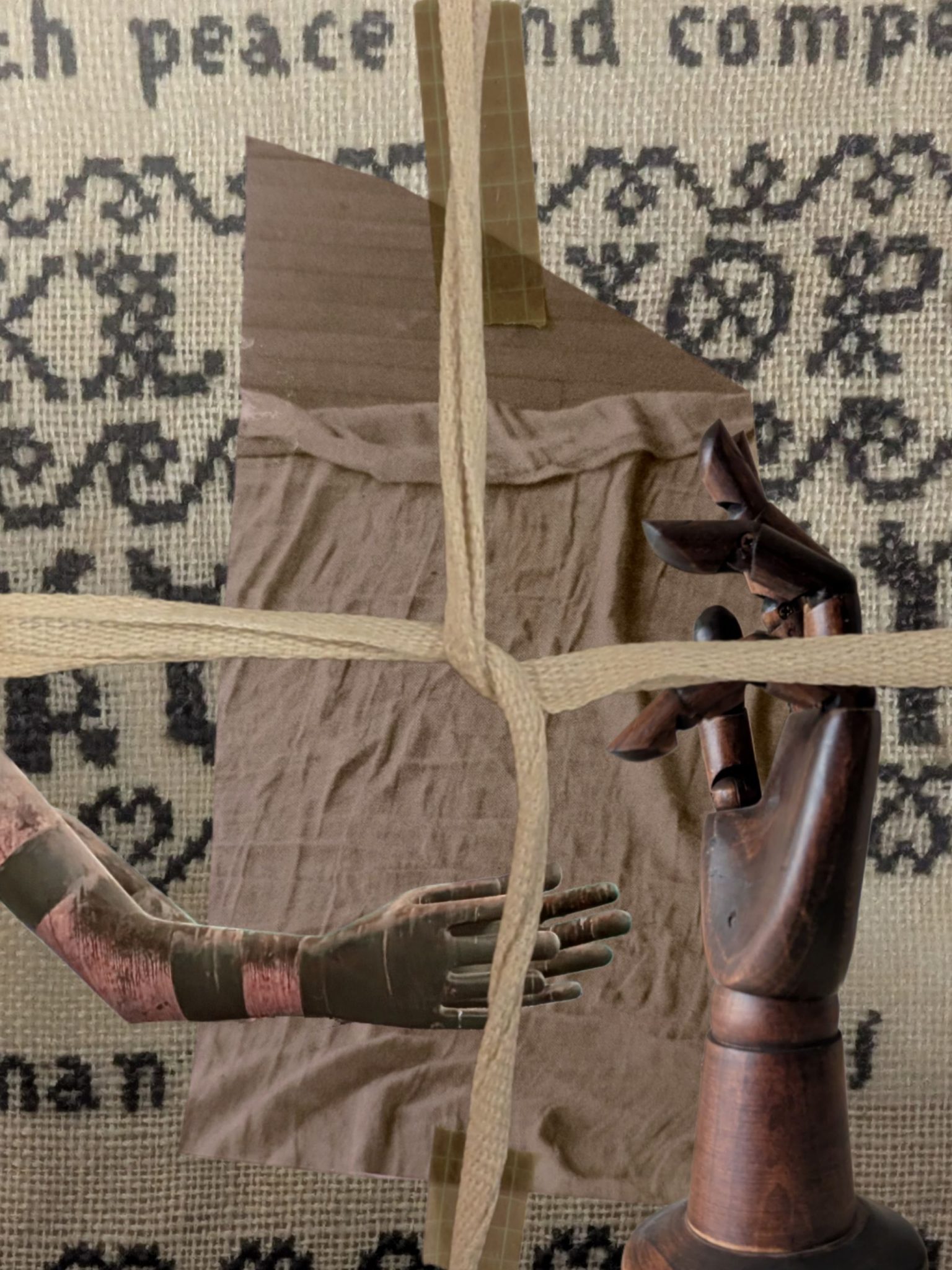 A digital layered collage. A wooden hand, a metal hand are gesturing. They are laid over a patch of fabric taped, and laid over an embroidery sampler. The whole image is tied in a cross with fabric tape