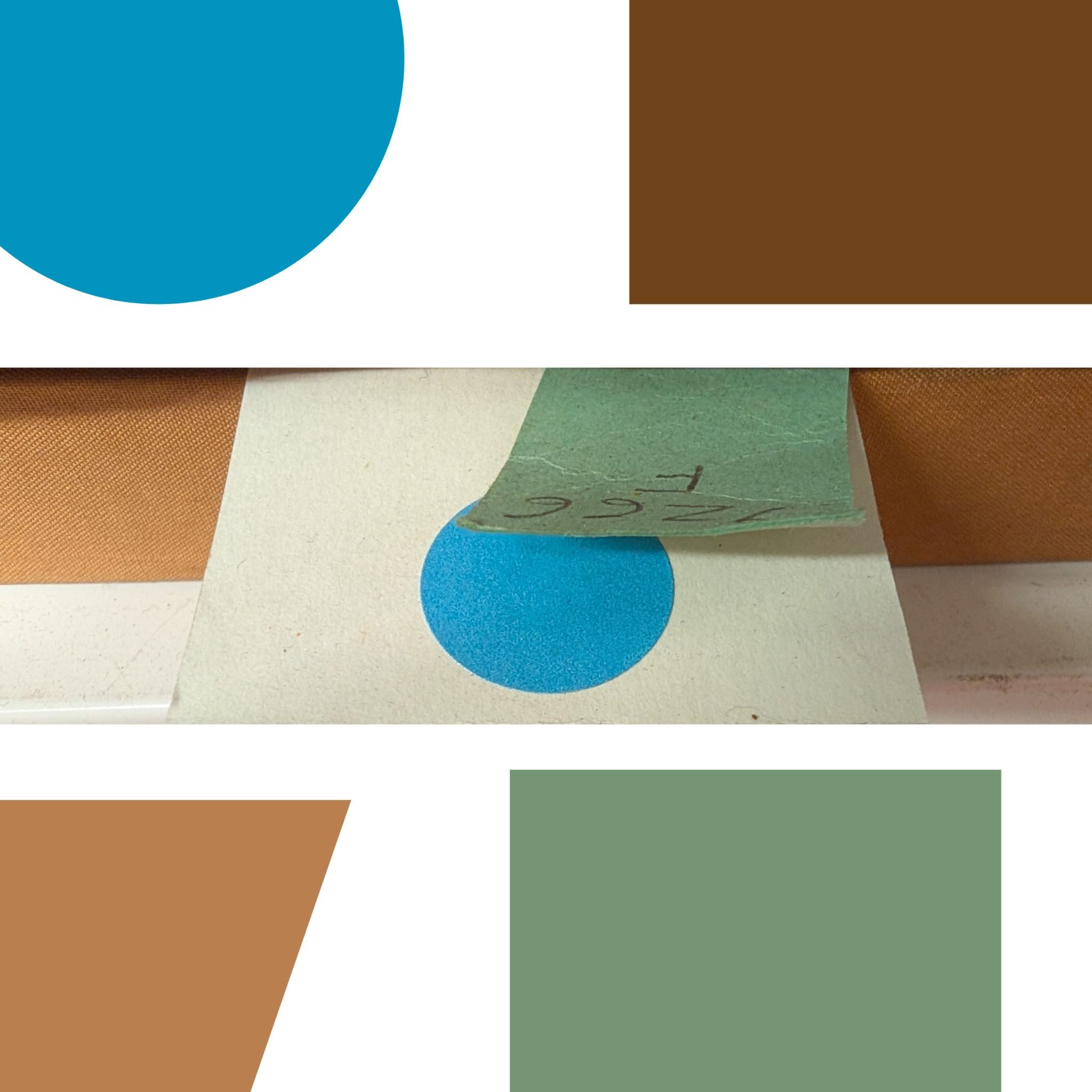 A close up picture of coloured paper and sections of books