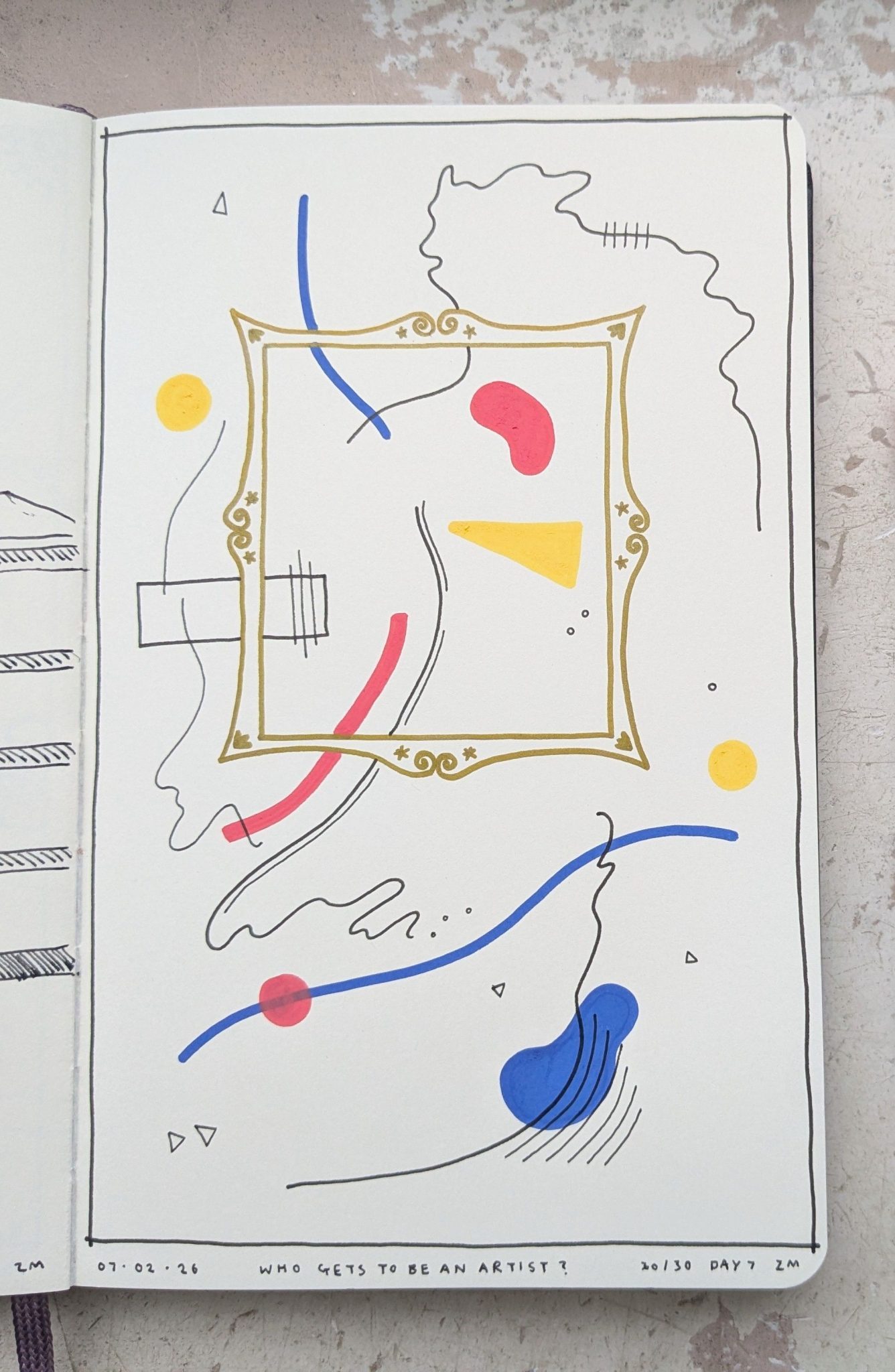 Photograph of a sketchbook page. The page shows an abstract drawing using blue, red and yellow paint with a gold frame.
