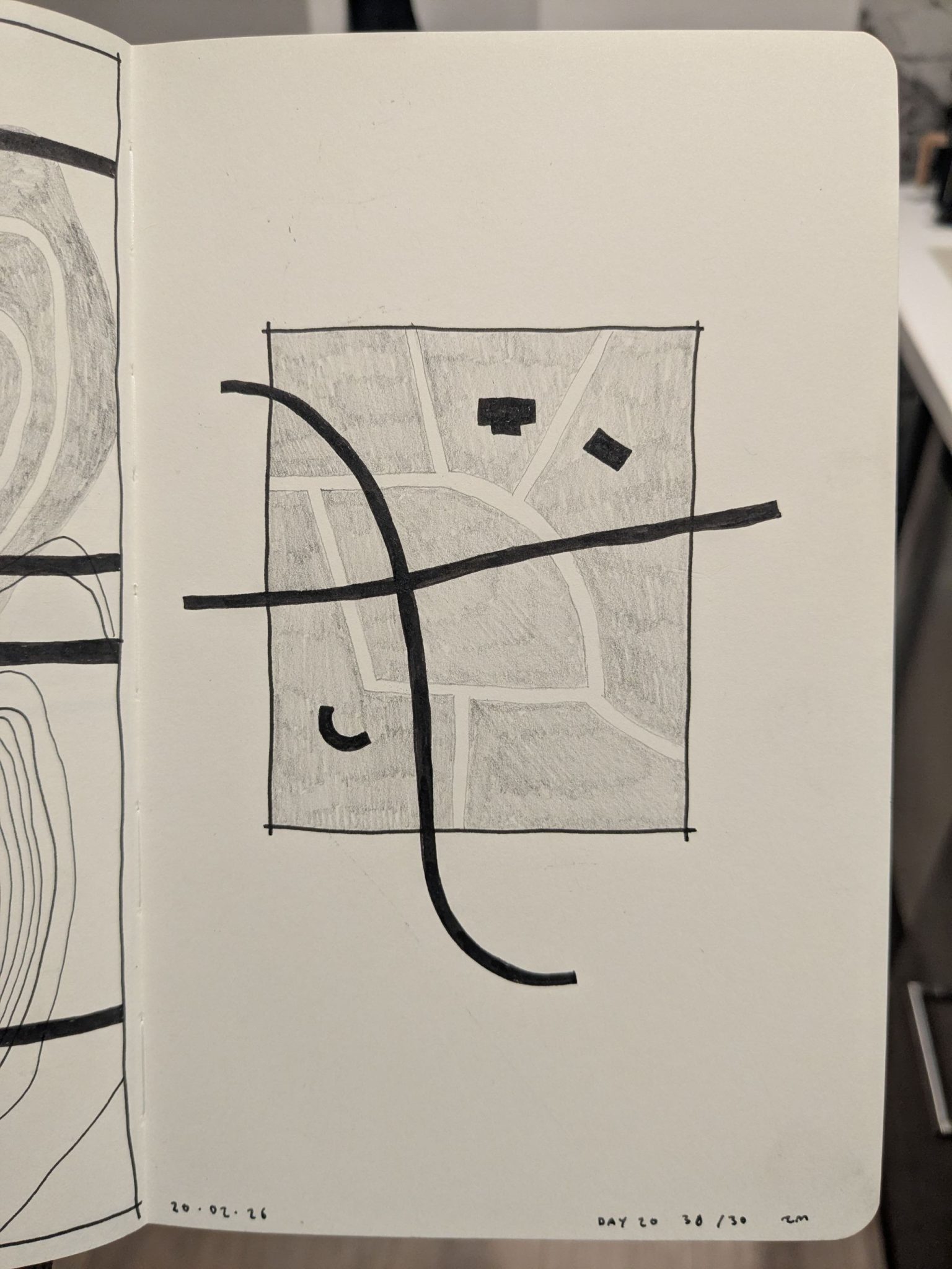 Photo of a sketchbook page with an abstract drawing