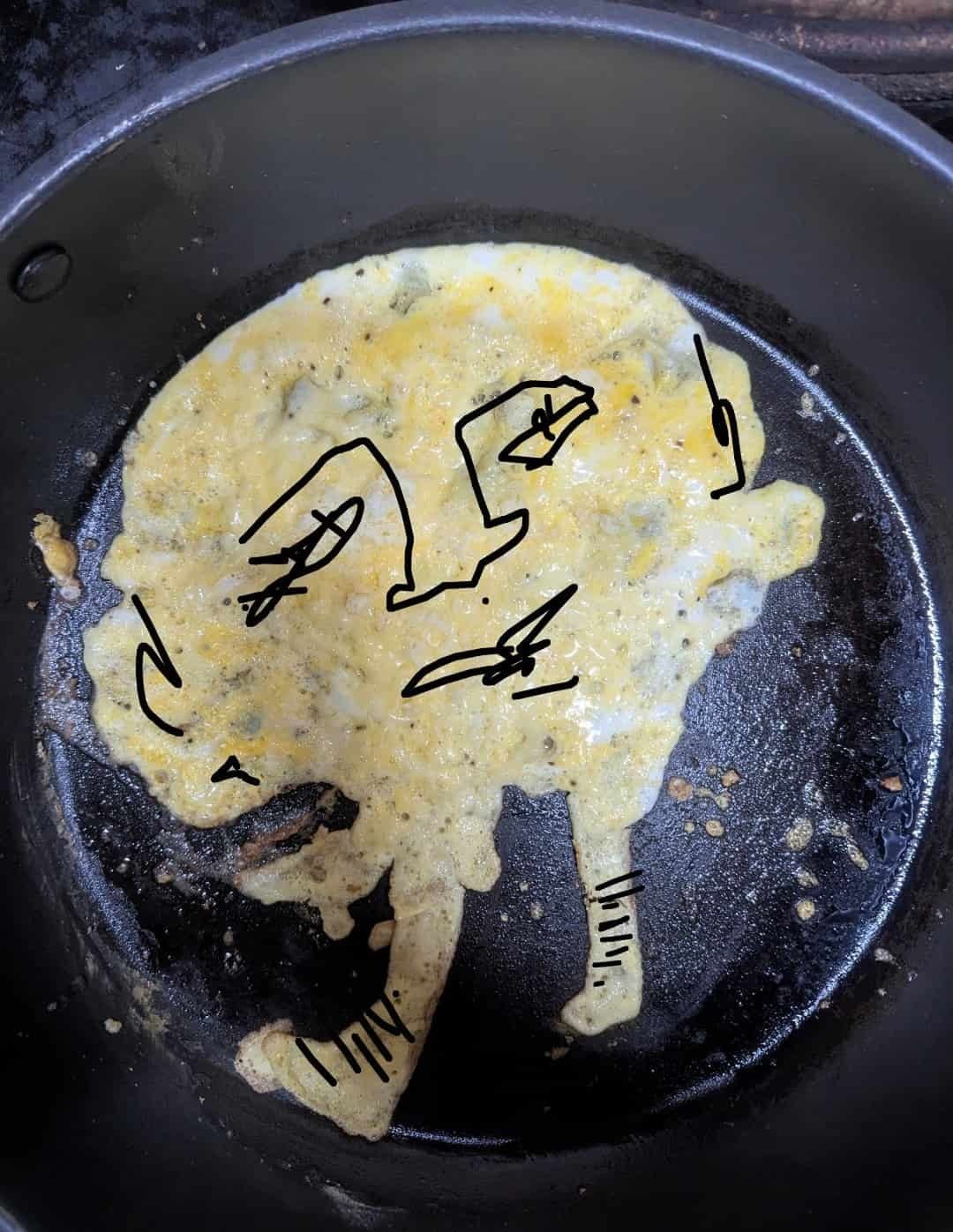 An omelette, with a drawn on face