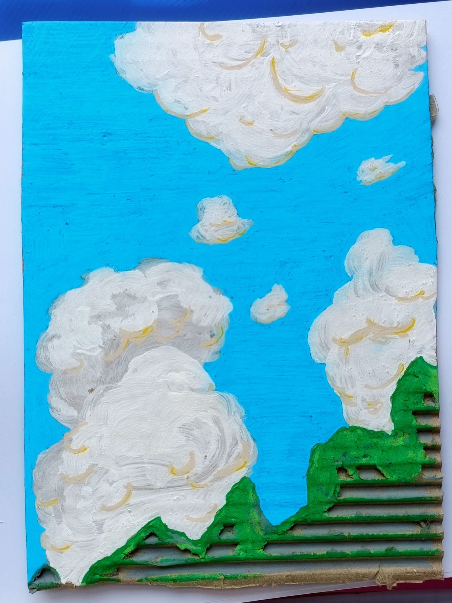 fluffy white clouds over mossy rocks, posca pens on cardboard.