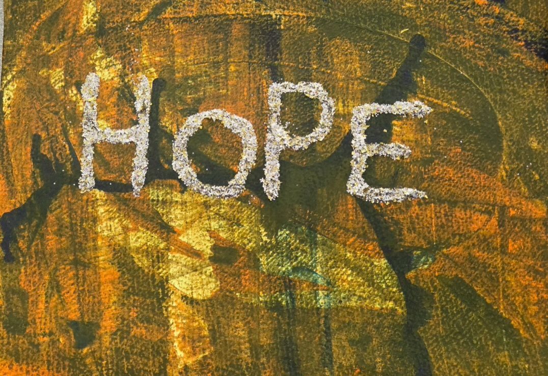 Glittery hope on a background done blindfolded.