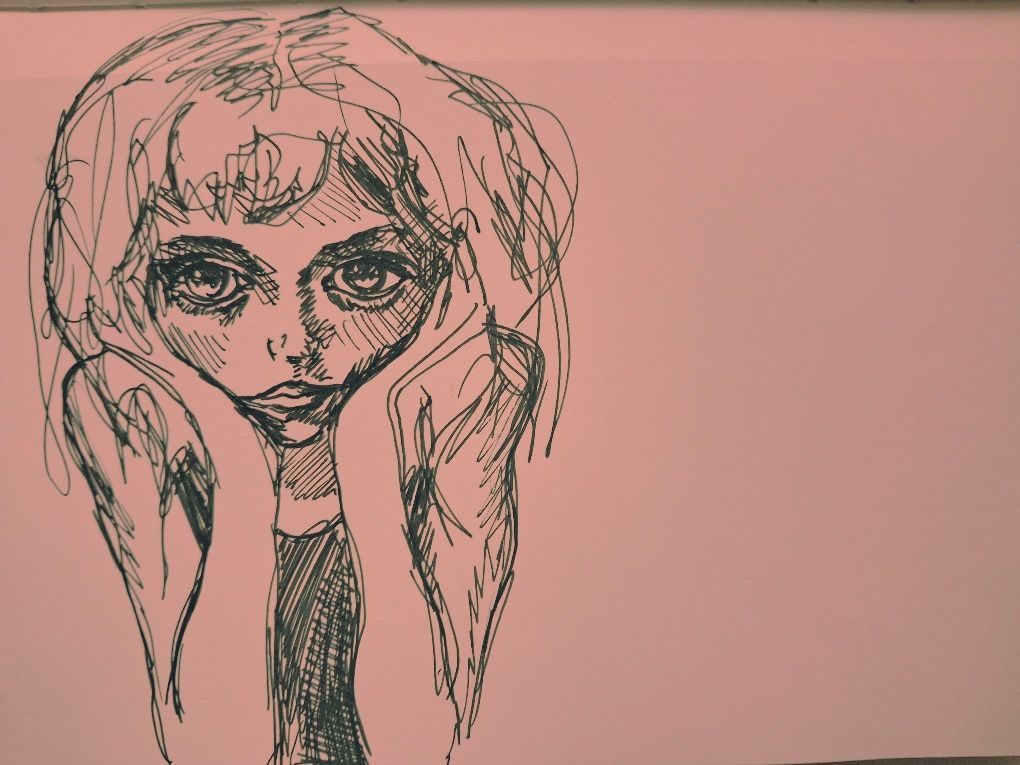 Ballpoint sketch of a woman with her face in her hands
