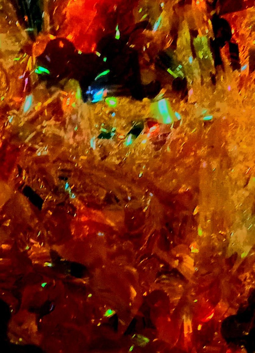 Abstract photo in orange and gold with highlights of bright green and blue