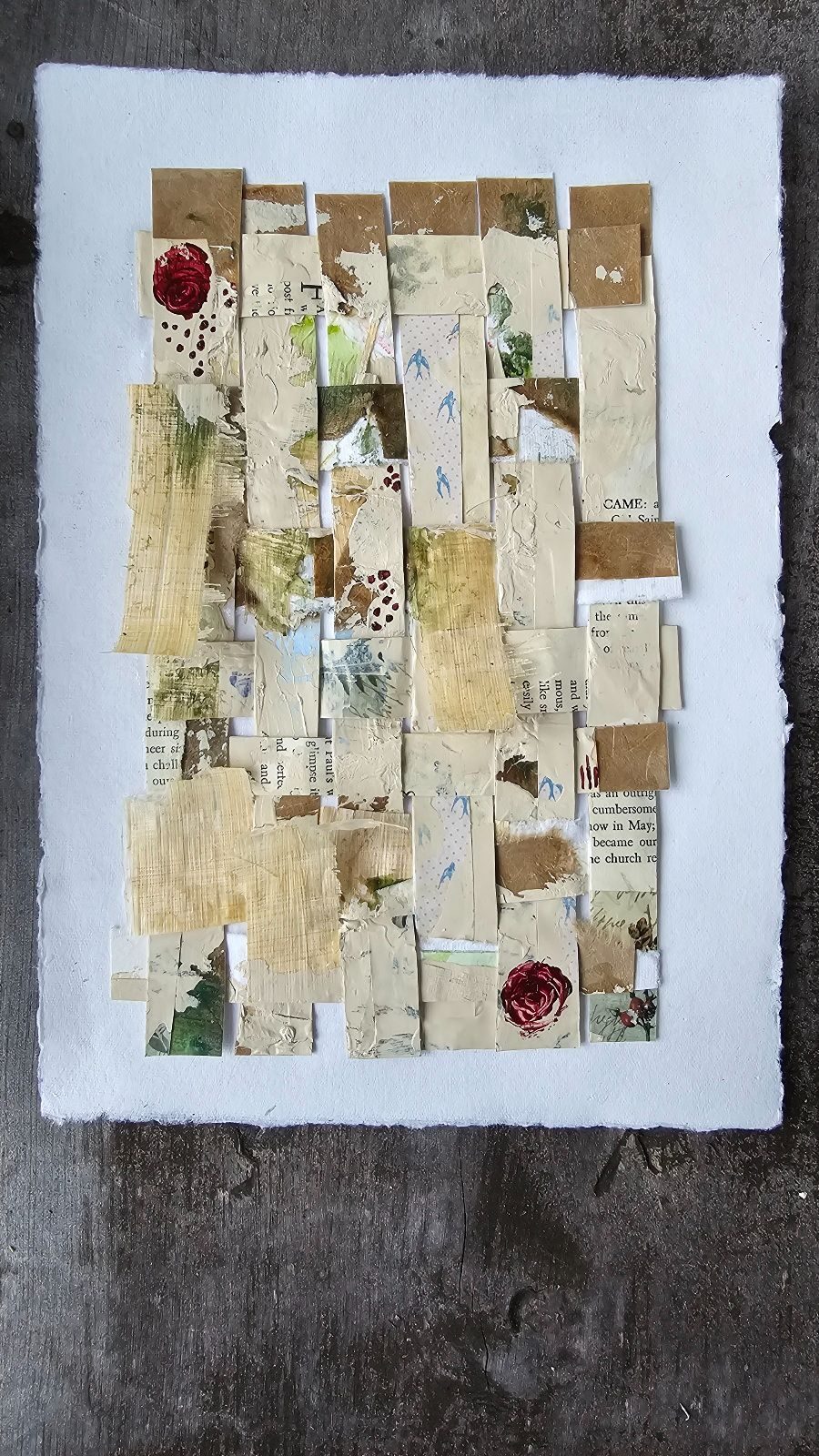 Woven piece made of strips of acrylic and paper collage