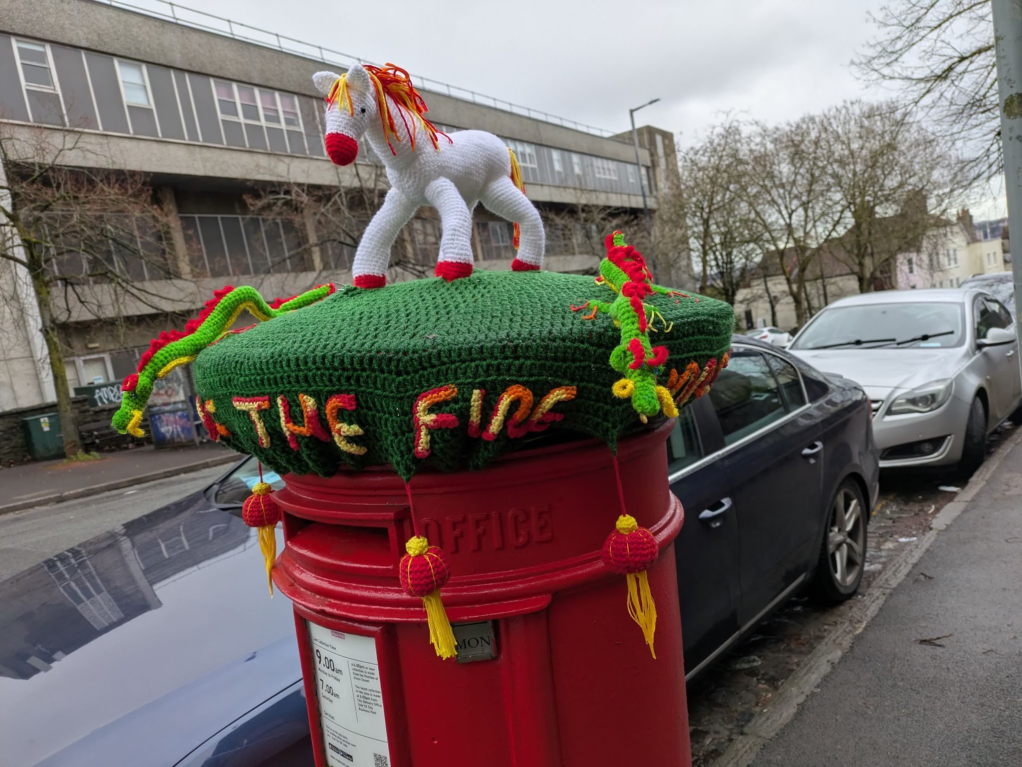 Knitted unicorn on post box