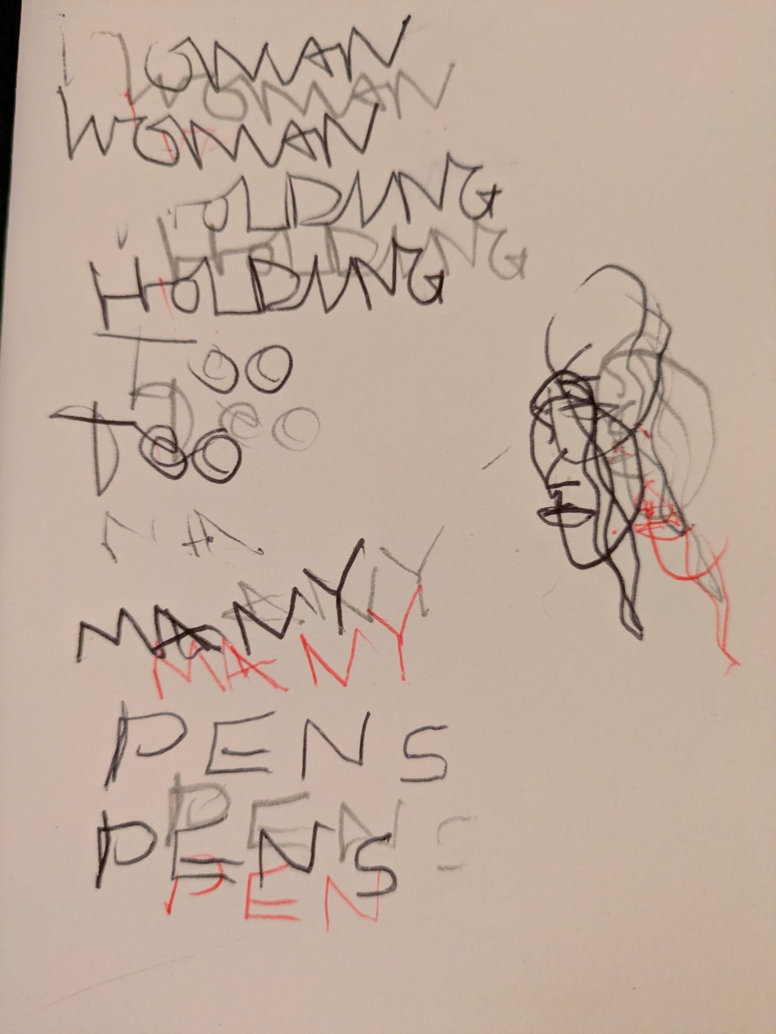 Woman holding to many pens is written in a white sheet of paper using multiple pens at once, the text overlapping itself