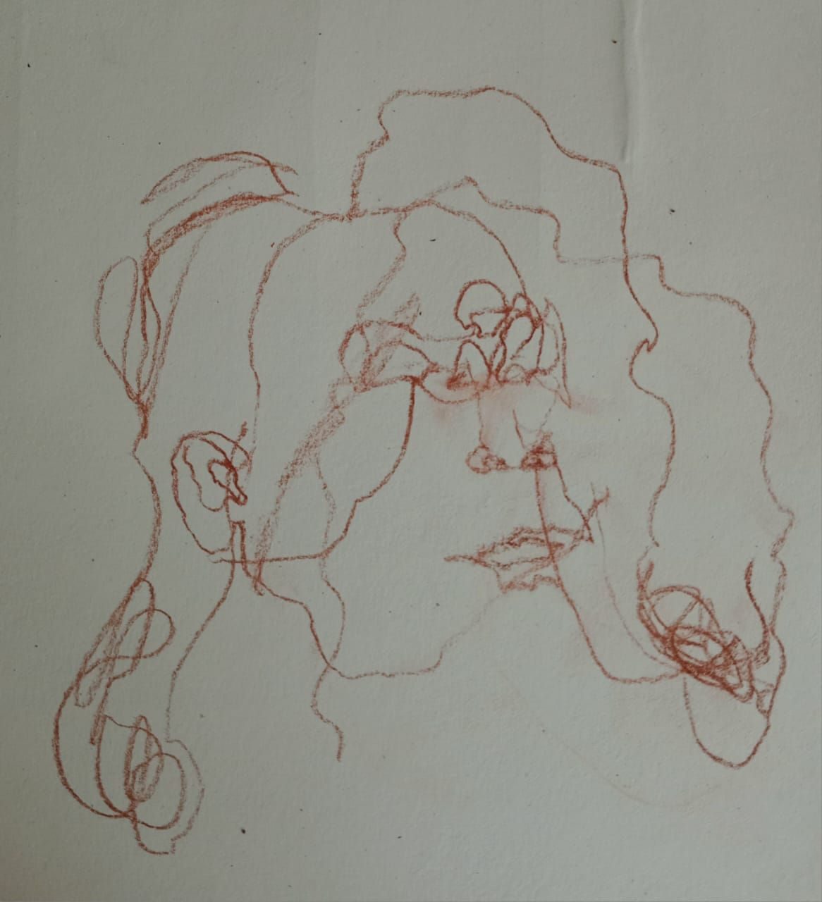 Self portrait drawn on paper blindfolded