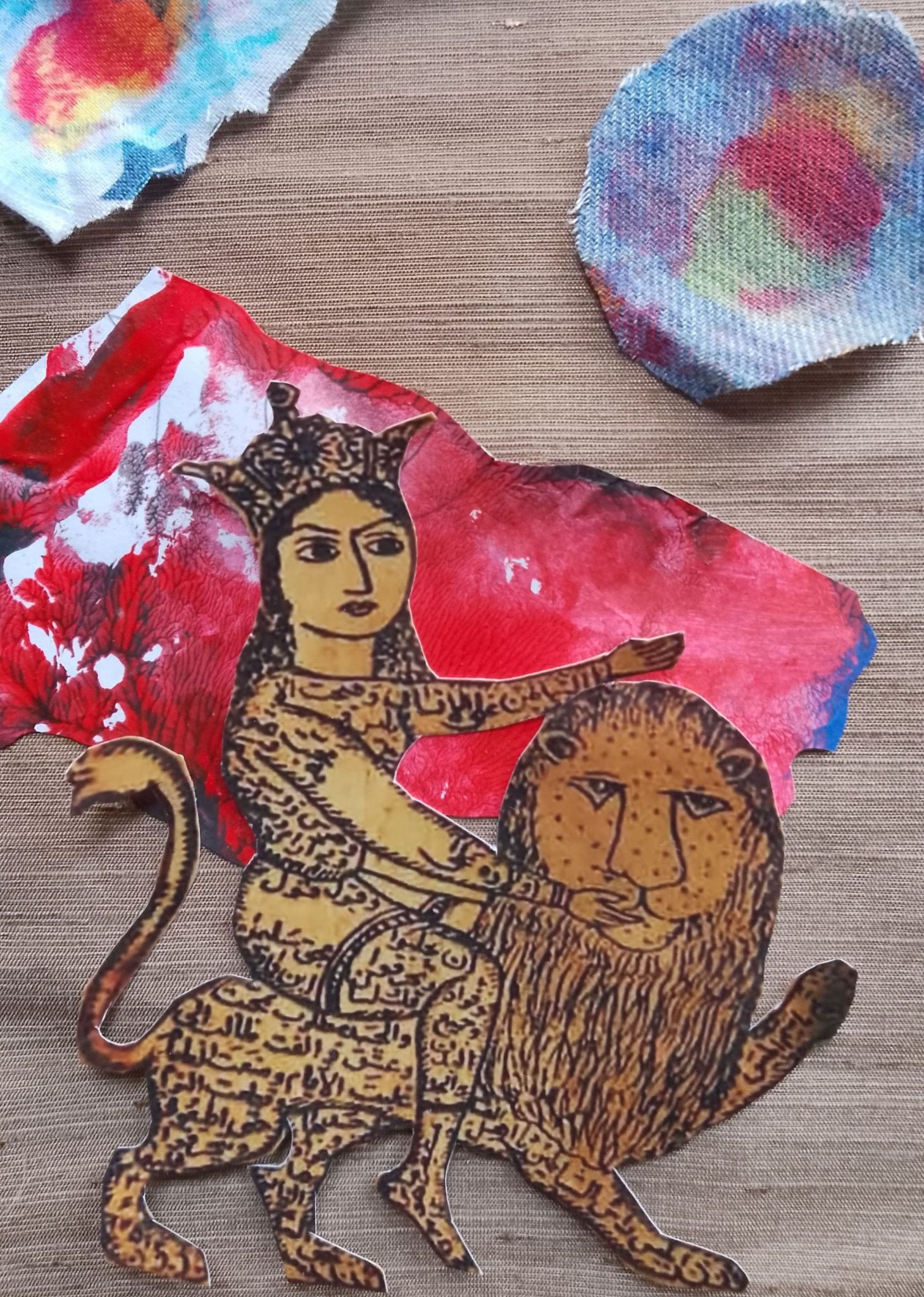 Mixed media collage showing a woman riding a lion thereis a disc and syrange cloudswith stars  in the sky and a bloody mountain at the dsitant