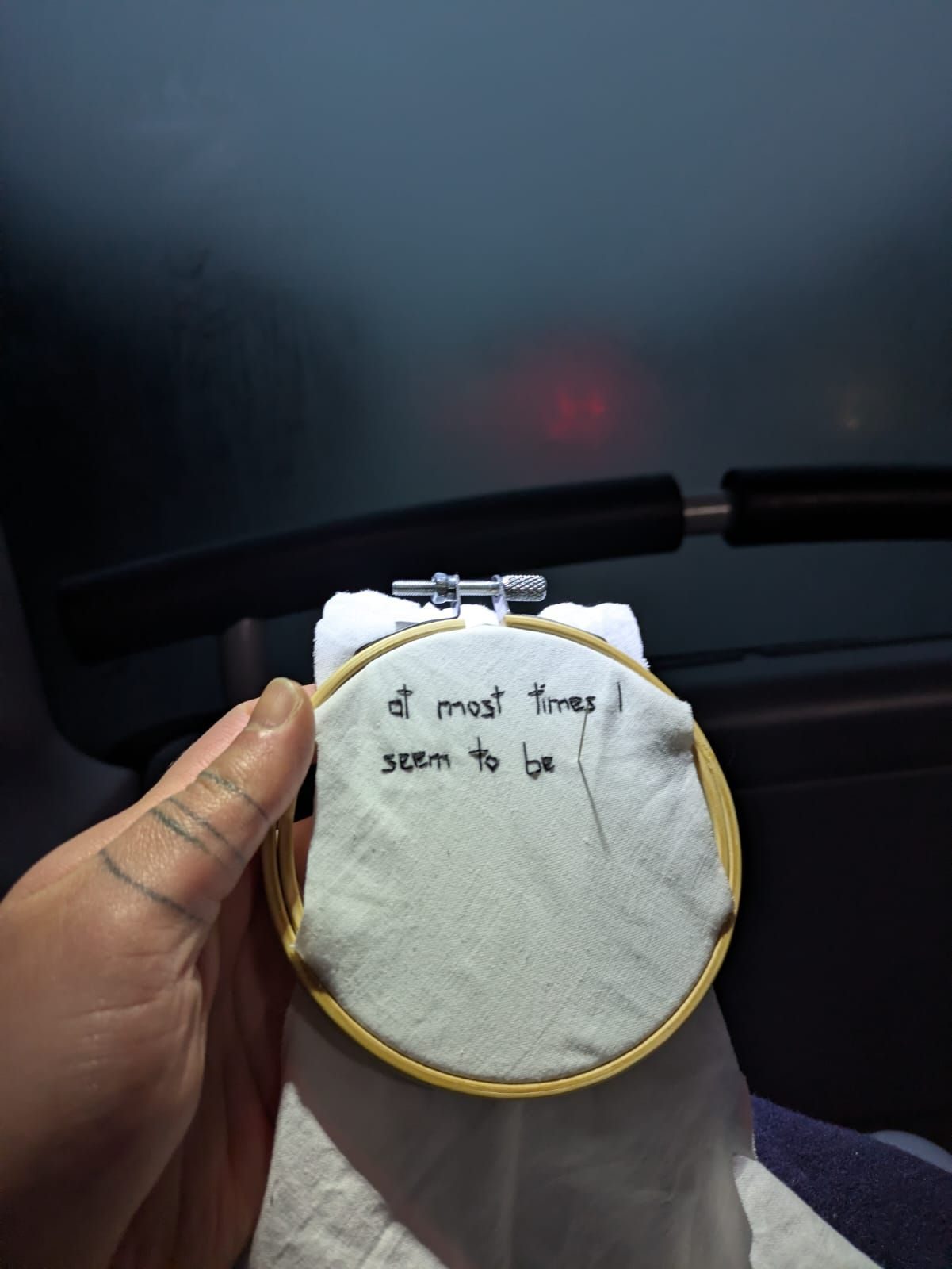 Photo of embroidery hoop with stitched words