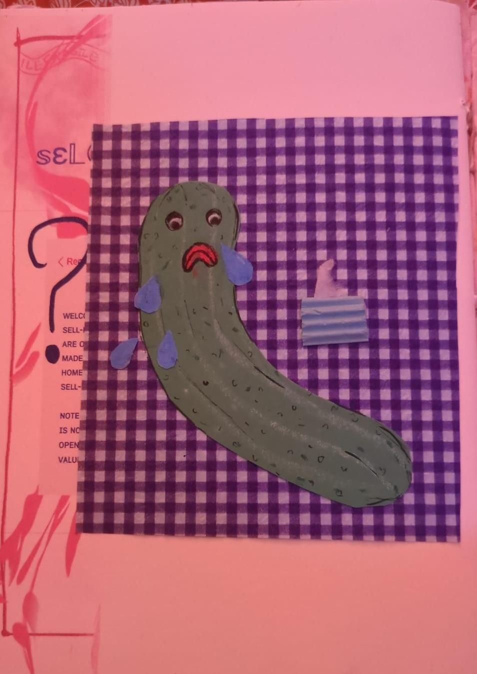 A collage and drawing of a very sad pickle using cut up paper, crayons and pen. Theres a tiny tissue box next to the pickle and the pickle has a very sad crying face.
