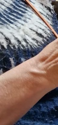 detail of fairisle jumper and arm