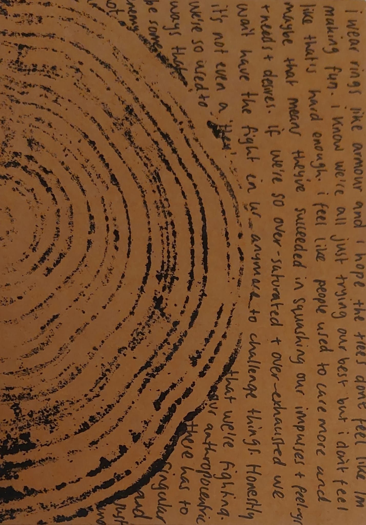 print of a tree cross-segment with ink and writing on the right hand side of it