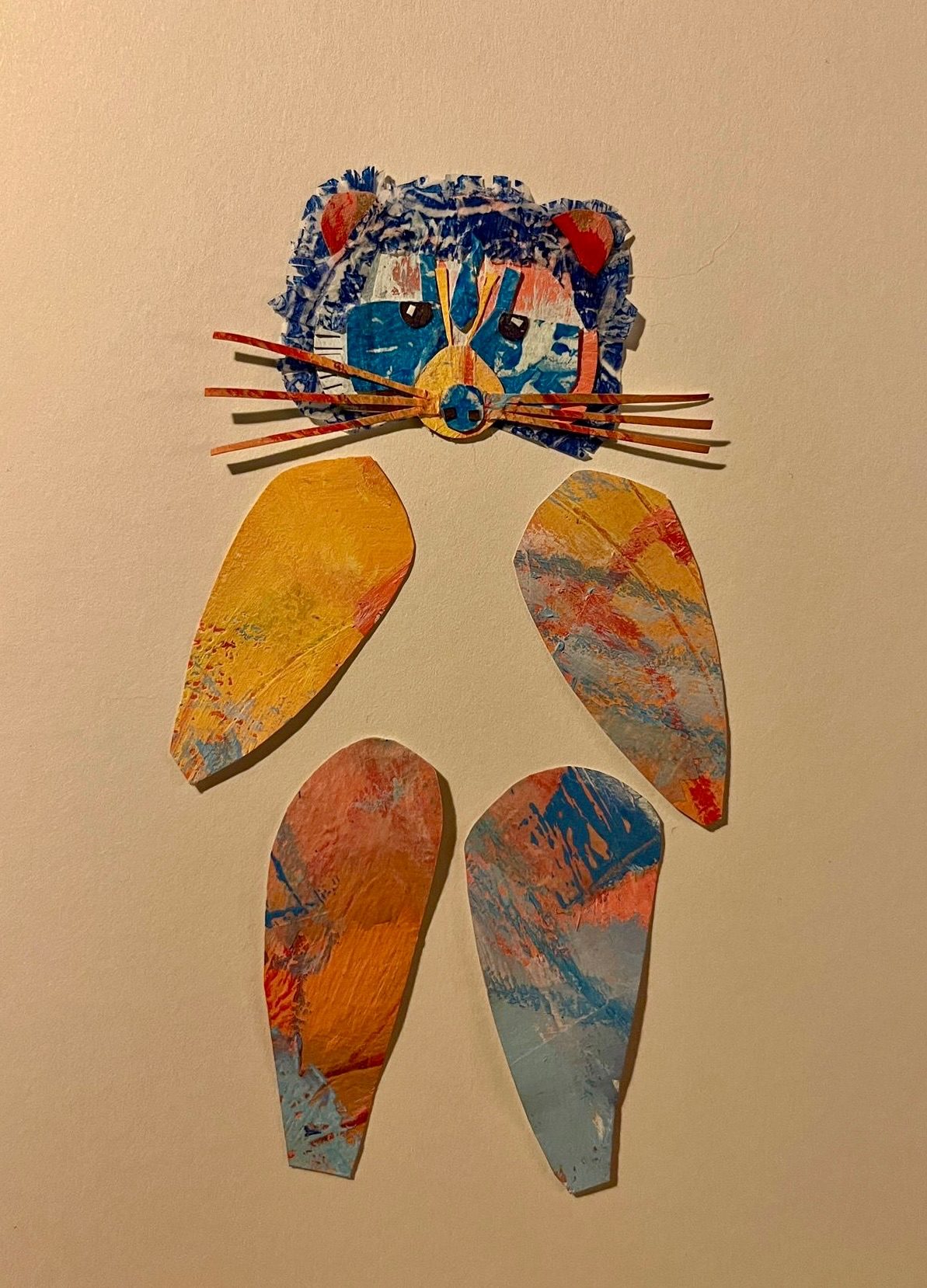 Collage raccoon head with 4 limb like shapes