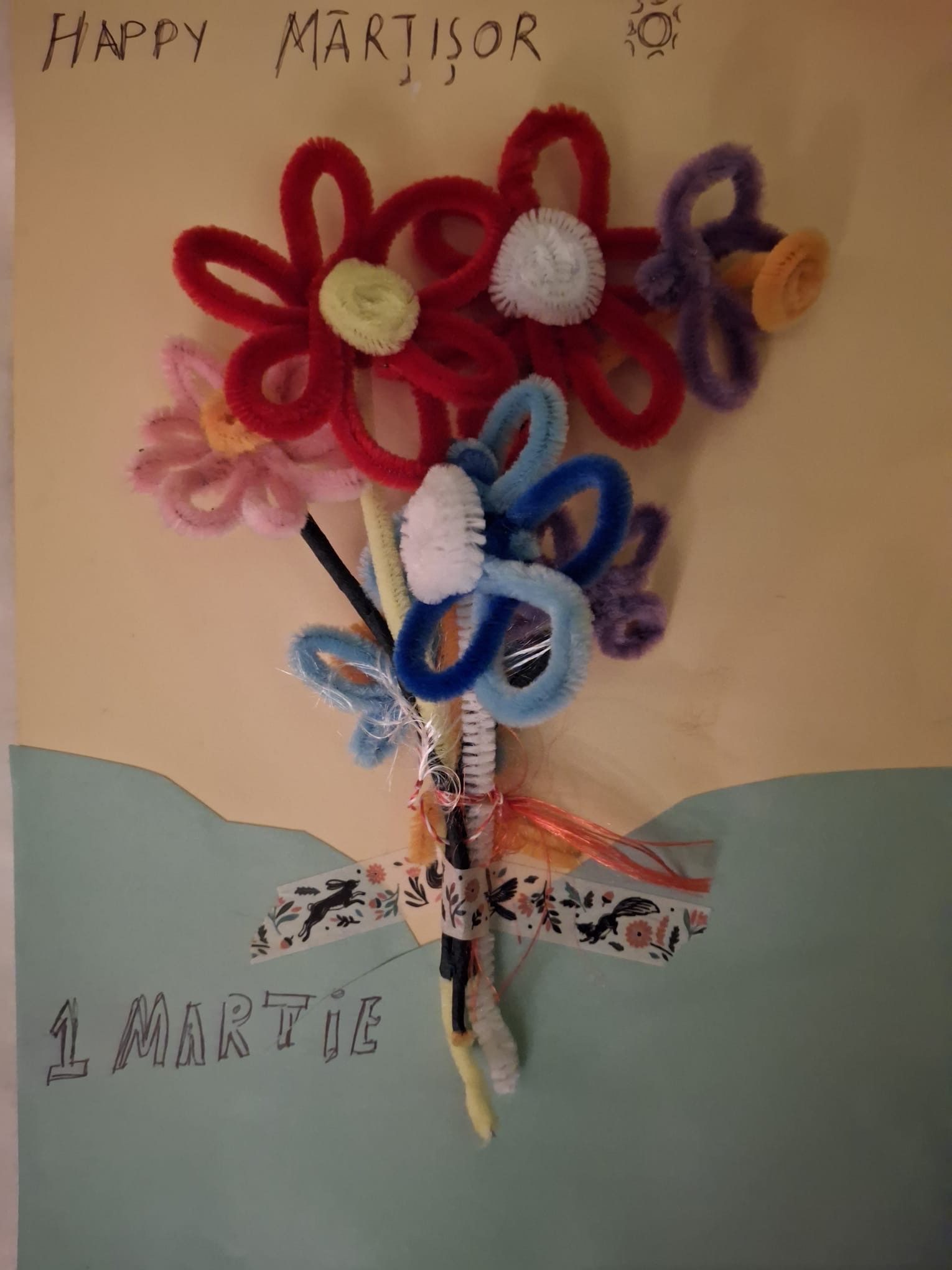 A bunch of flowers of different colours crafted with pipe cleaners