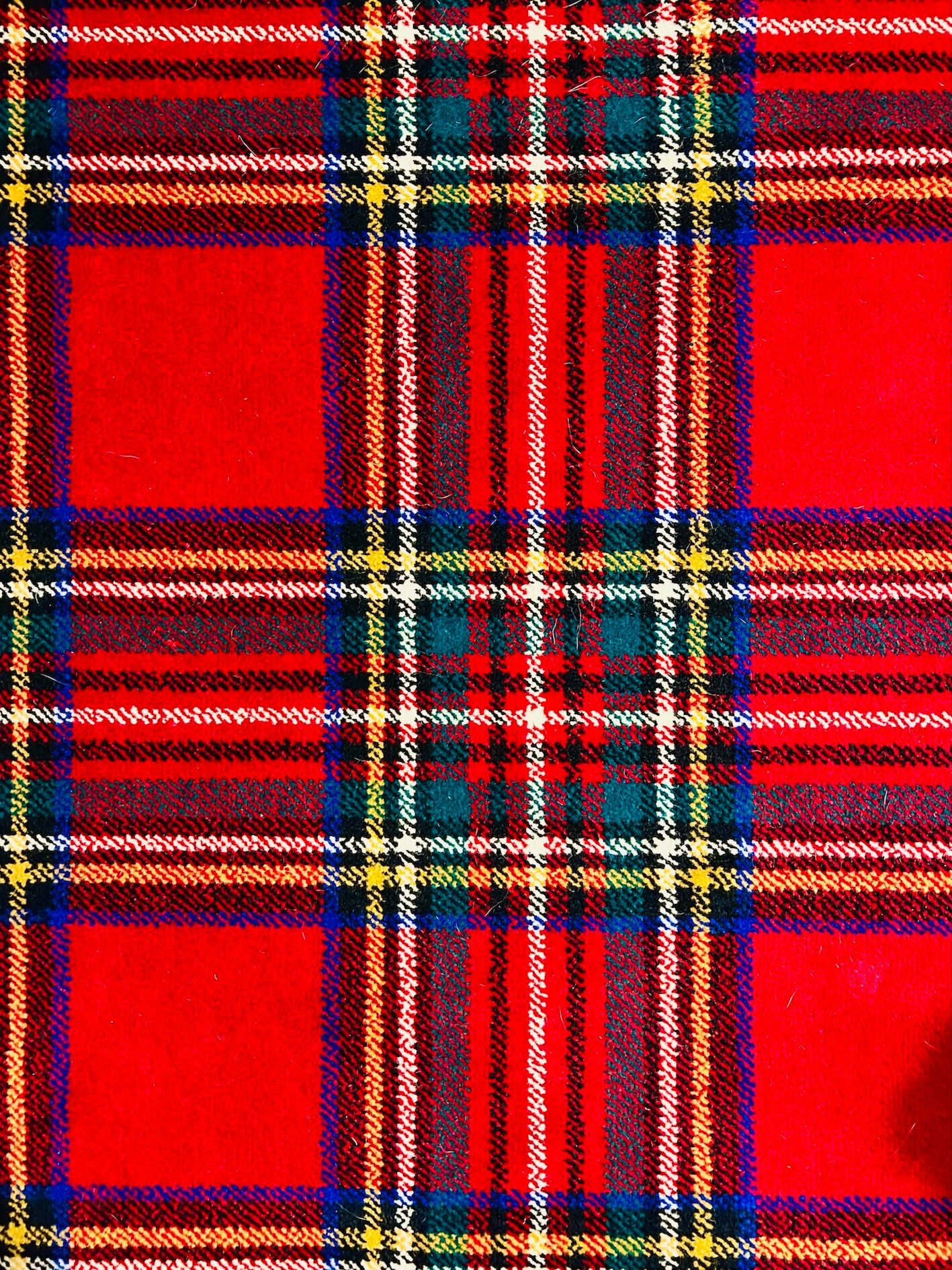Red tartan pattern carpet close-up photo