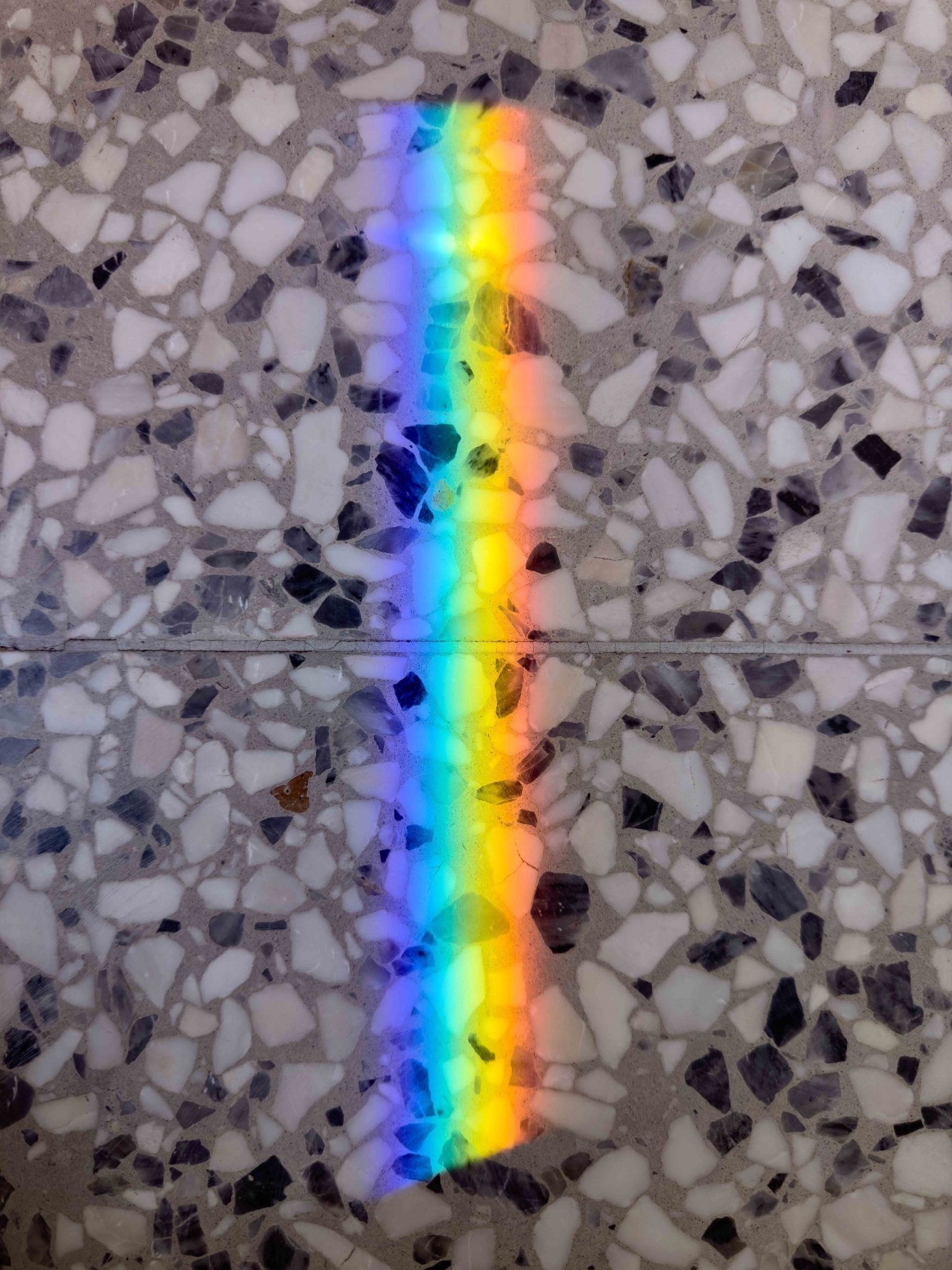 Refracted light in the colours of the rainbow