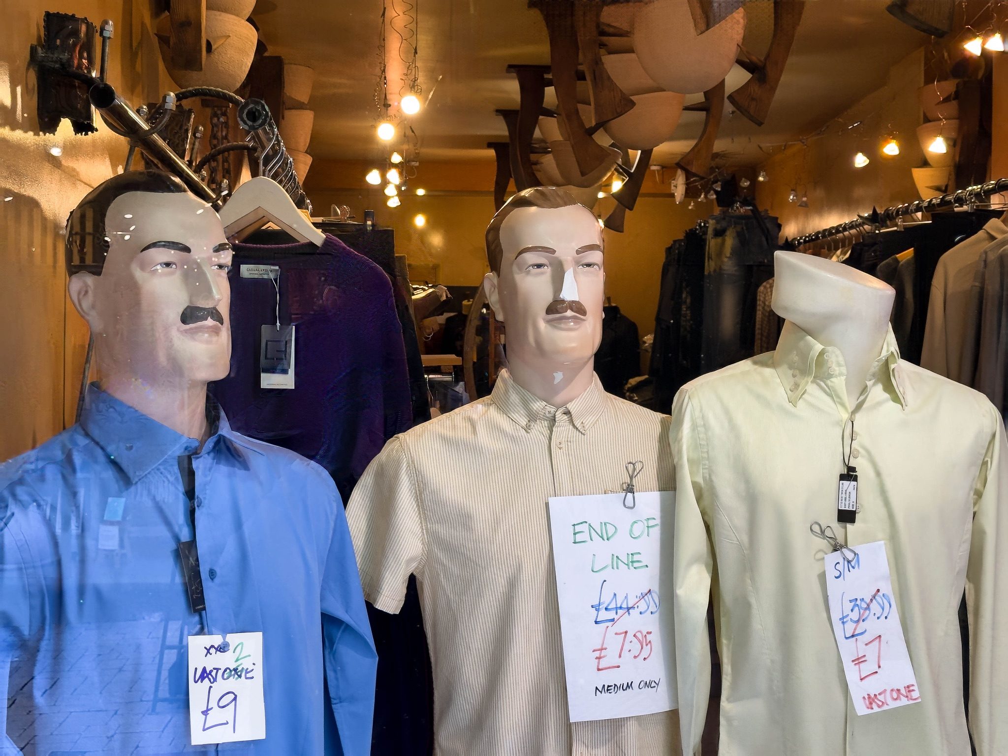 Mannequins wearing end of line shirts that are being sold off