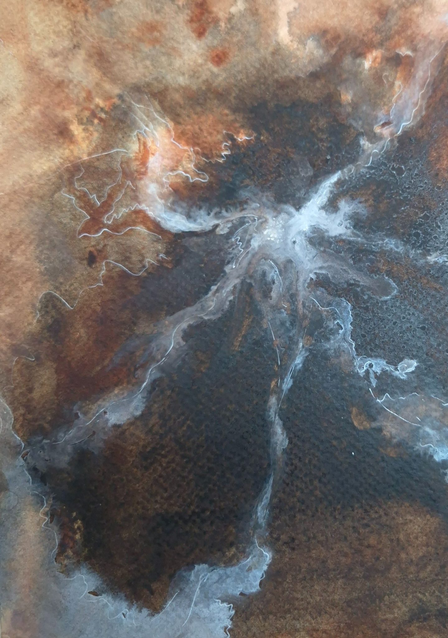Brown background with flowing white lines, as if looking at a volcano from above