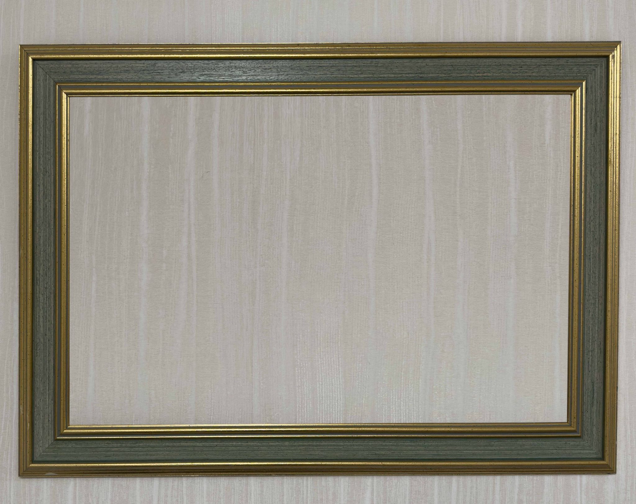 A photograph taken in front of a mirror, but the photographer does not appear in the mirror, only the background behind them appears.