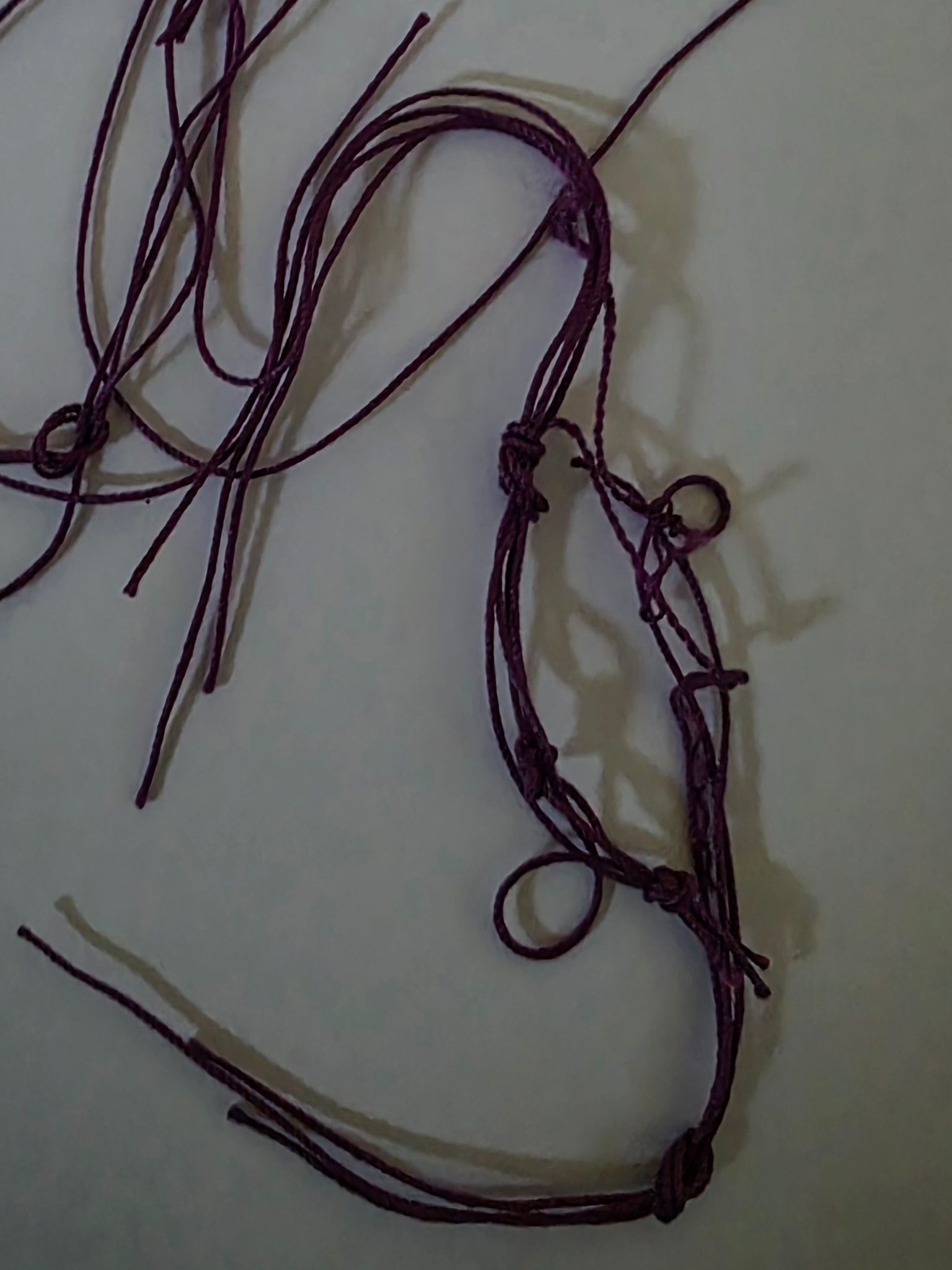 String knotted and arranged with shadows