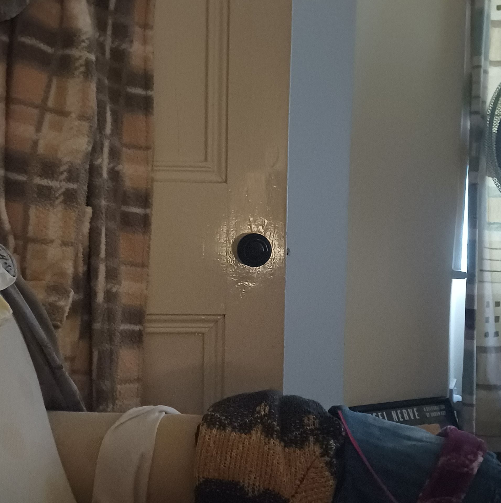 Strange reflected light appeared around the door knob like a glowing halo which was captured on camera.  It could only be seen from the exact spot I was sitting in, spooky ! hehe