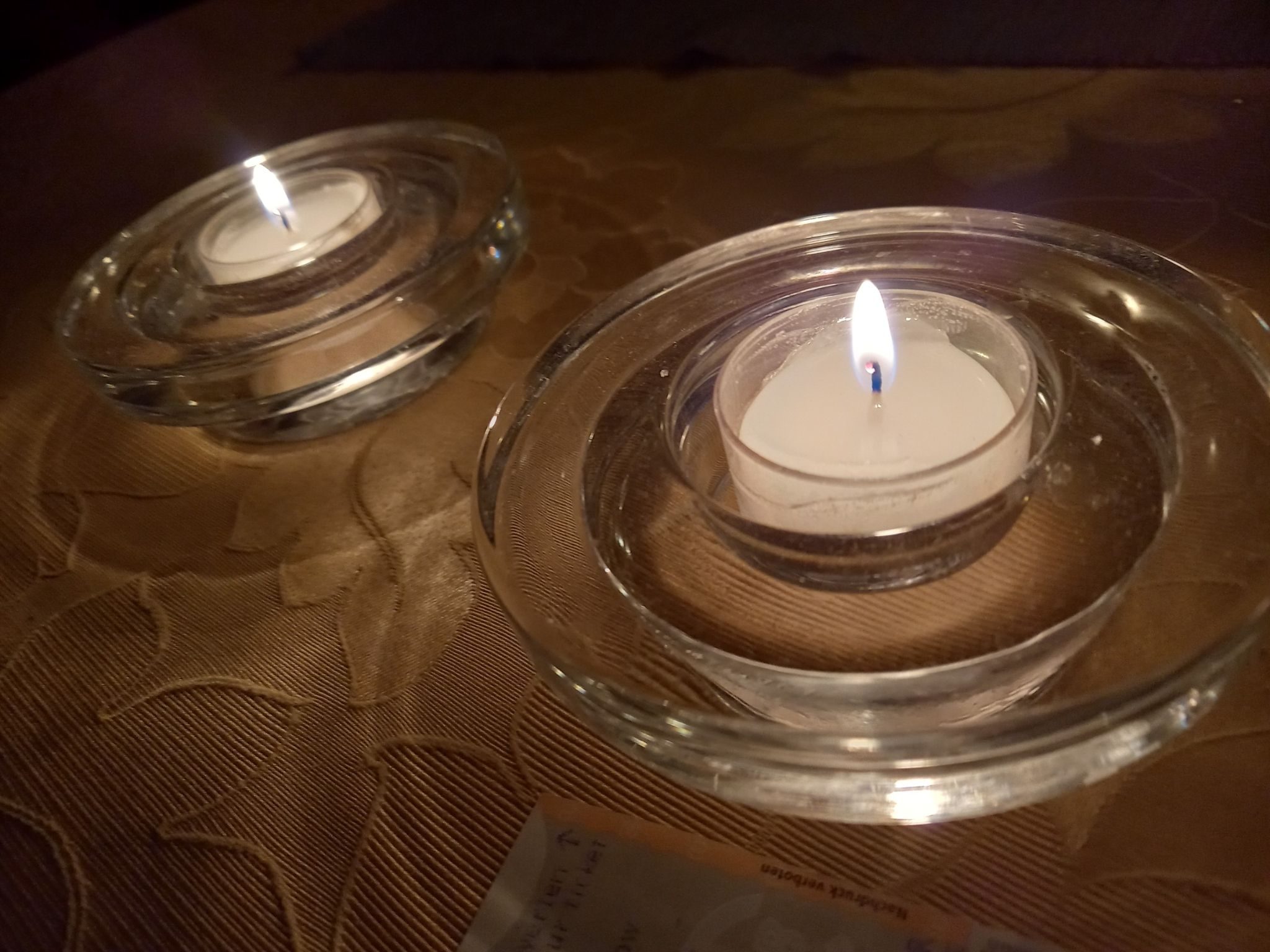 photograph of two burning candles