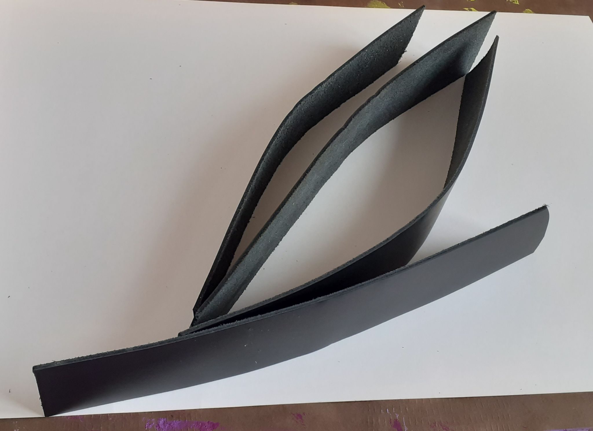 Leather recycled cut as leave with border sewed