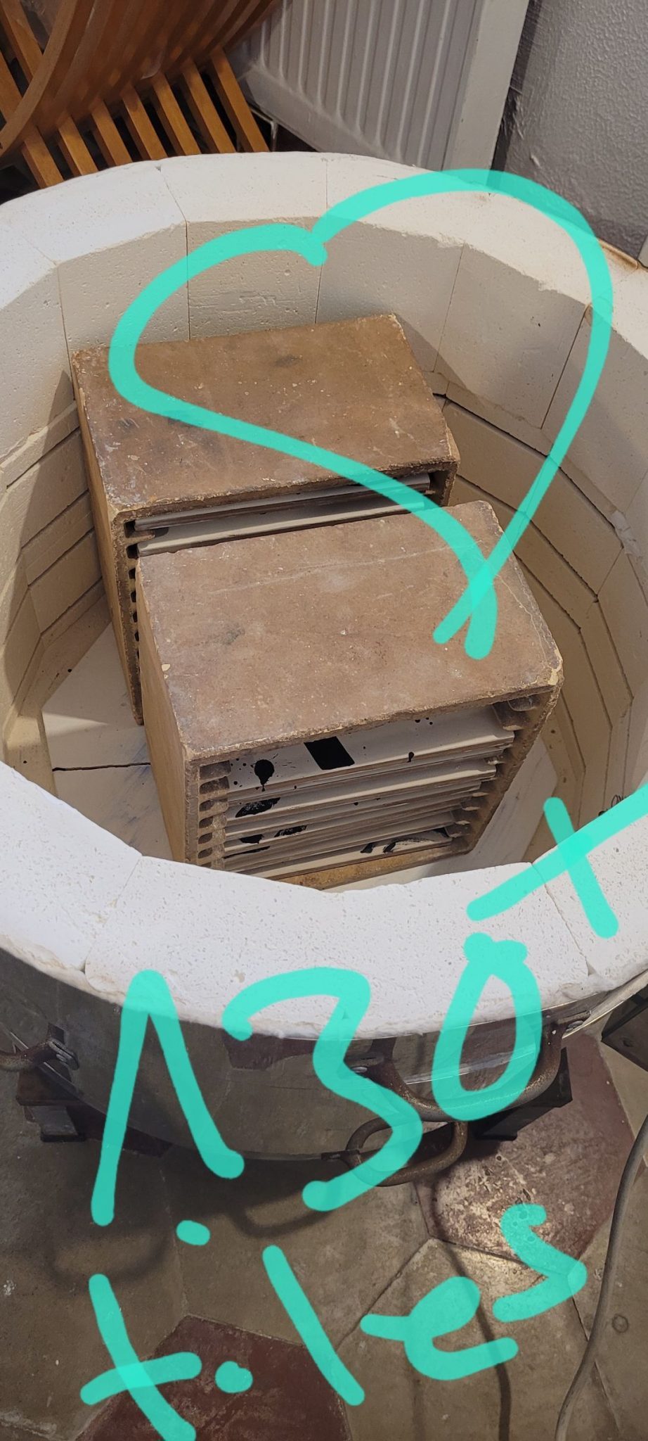 Inside ceramic kiln with tile racks