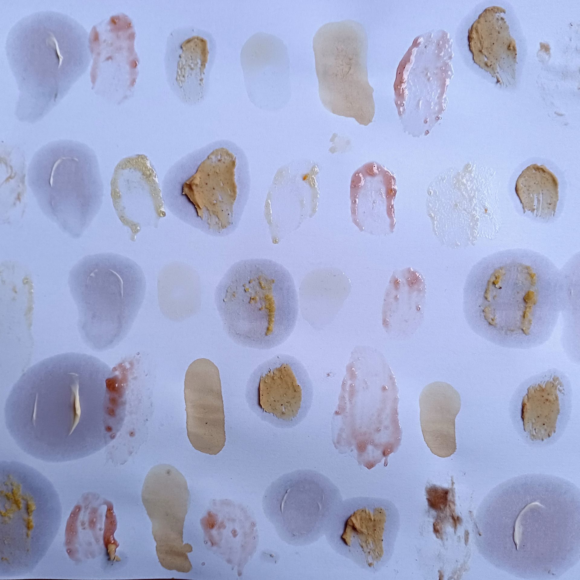 I dipped my finger in lots of different foodstuffs such ass jam, coffee, butter etc and then made a fingerprint of each dip, on a piece of paper, loosley following straight lines one above the other.  The grease in the foodstuffs such as butter and peanut butter spread around the finger prints into blobs and circles looking like messy and sticky finger blobs.  Most appeared in pale, possiblypastel like colours.