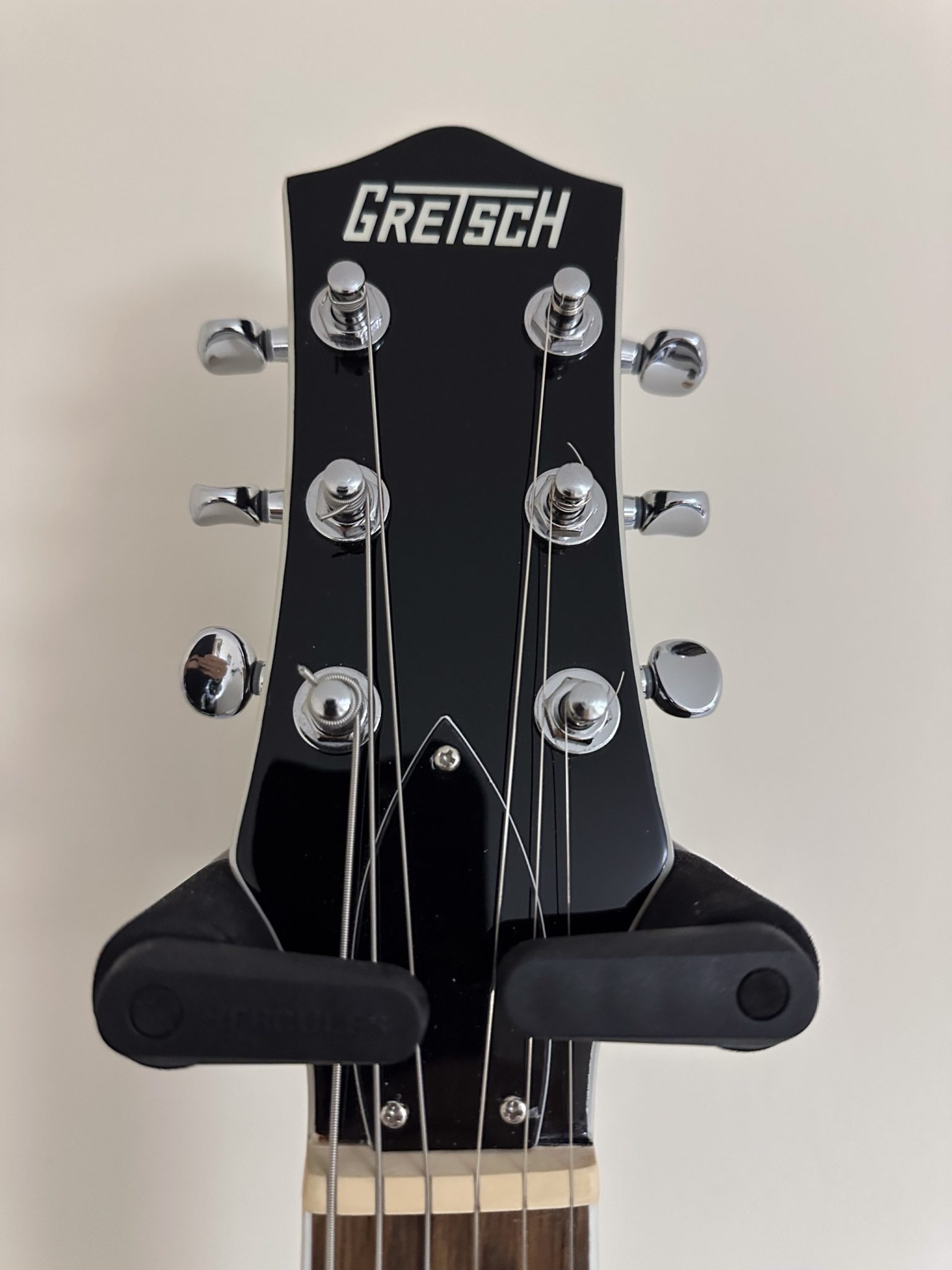 A photograph of an electric guitar headstock