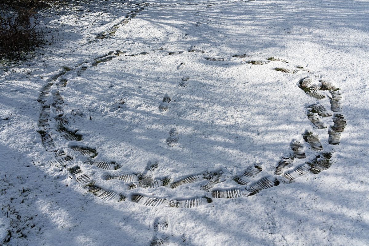 Tightly spaced footprints make a circle in the snow