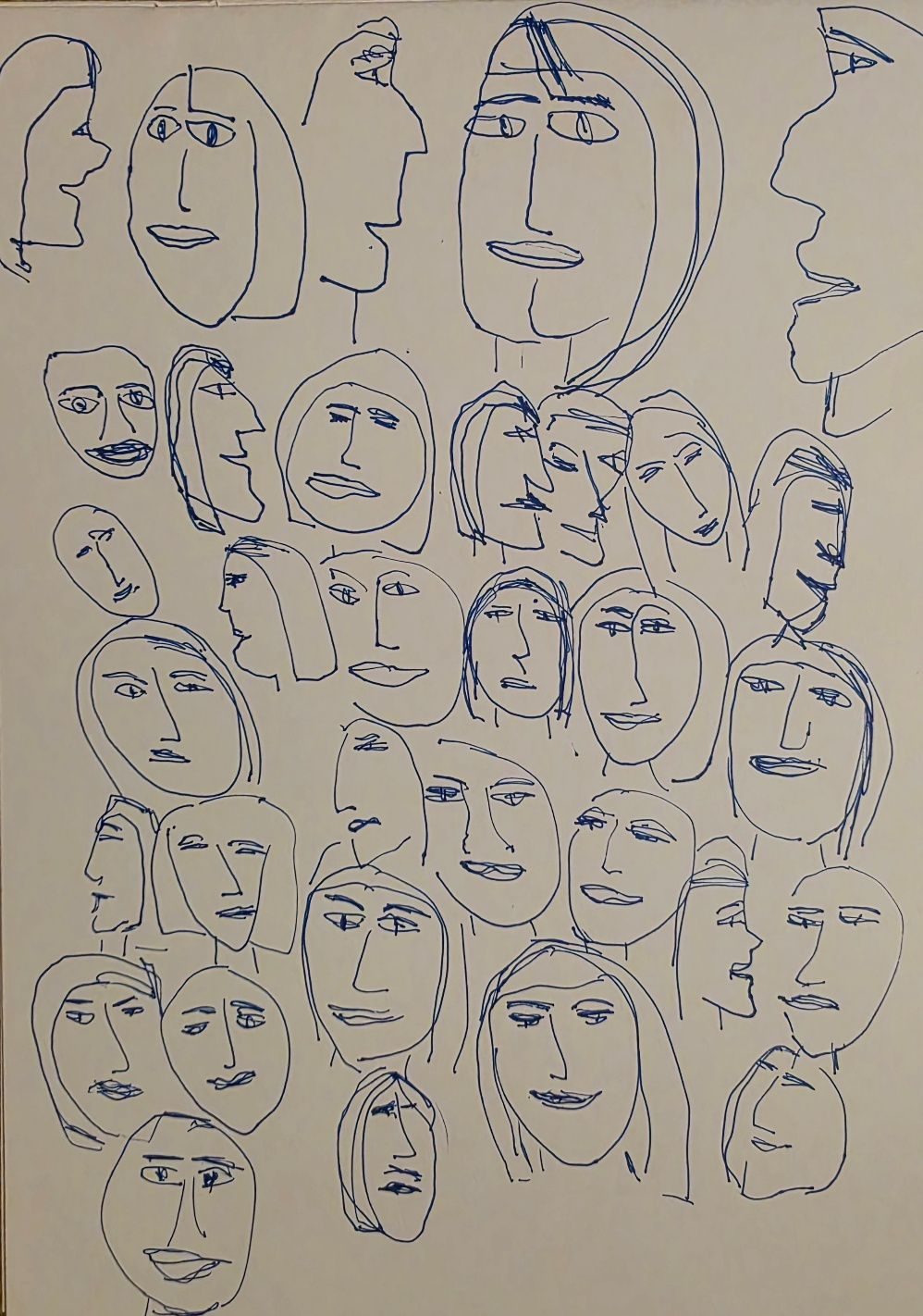 A page of faces in blue ink