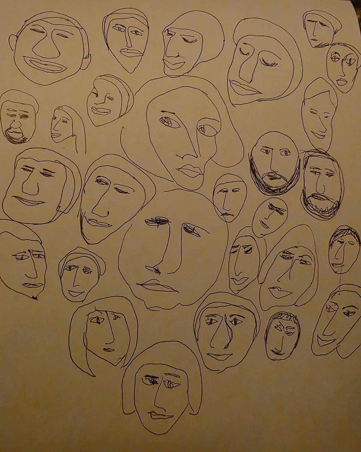 A mixture of faces drawn in blue ink