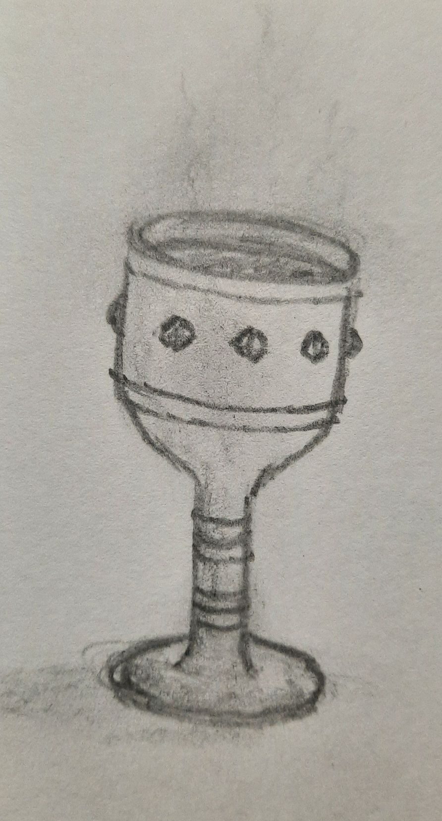 A pencil drawing of a small goblet, the liquid within seems to have a vapour raising from within.  The cup has a line of small stones that are near the top edge..
